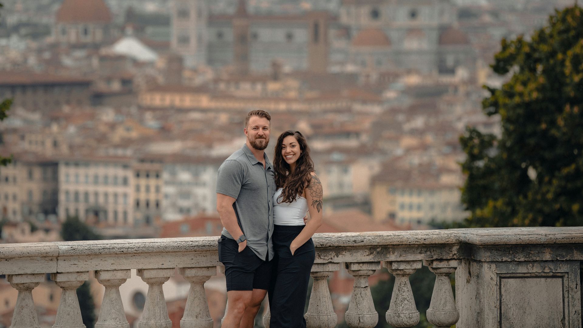 Couple posing with florence cityscape background