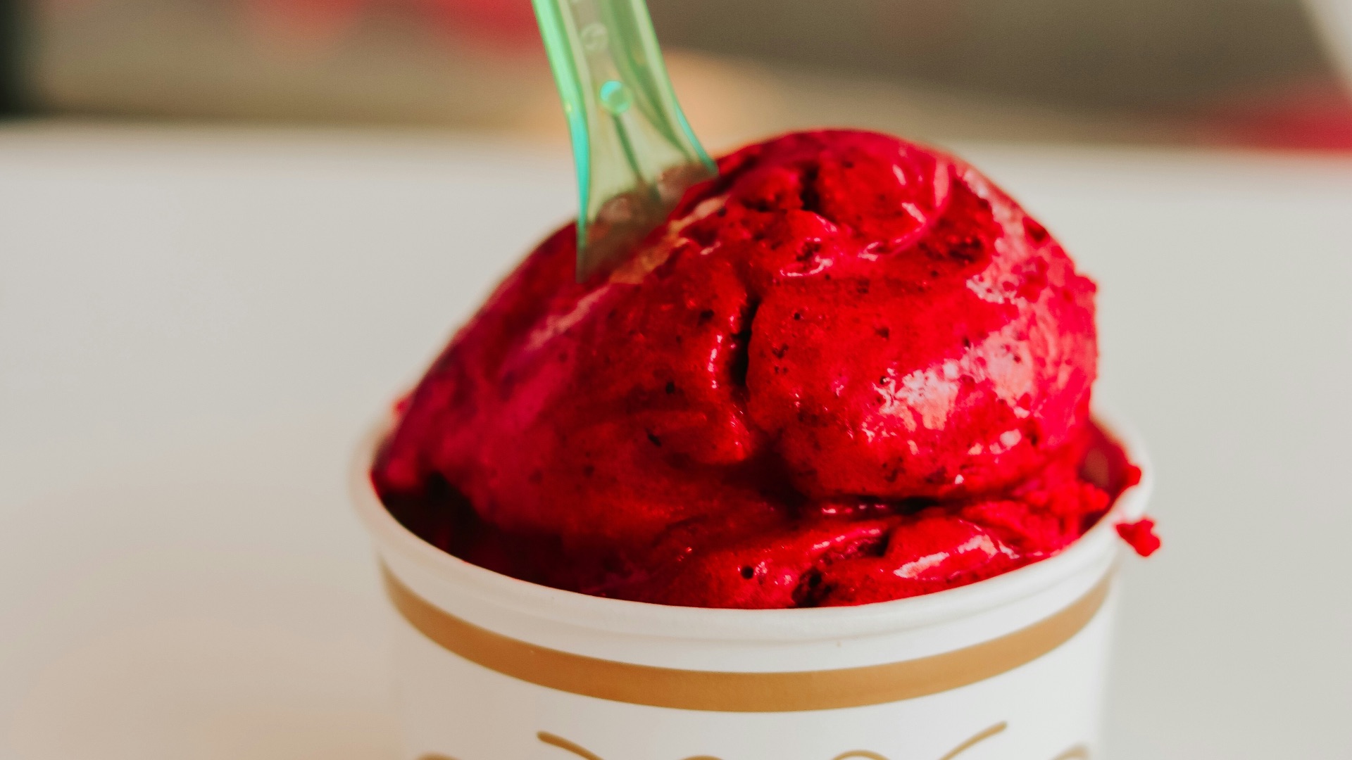 a cup of ice cream with a spoon in it