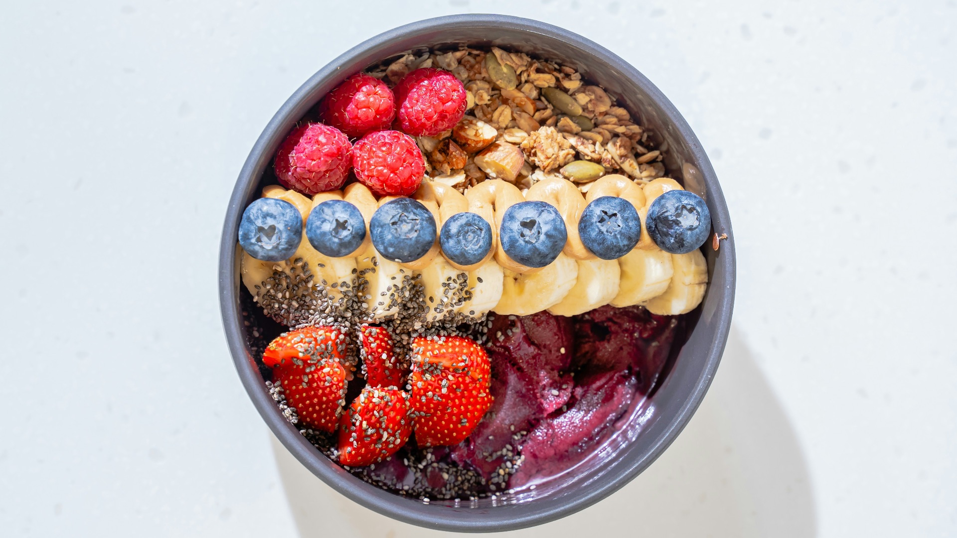 a bowl of cereal with milk and fruit