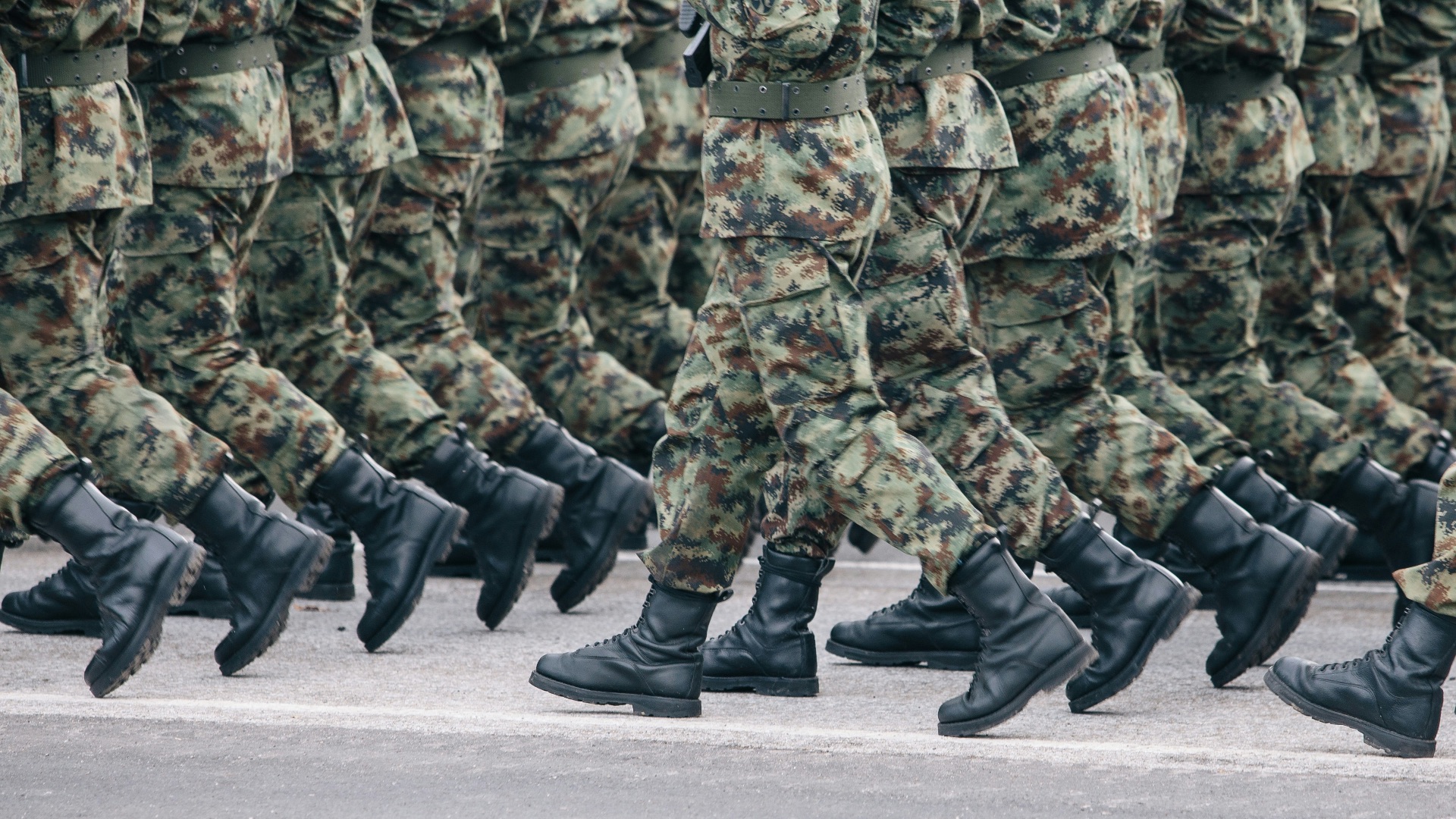men in green and brown camouflage uniform