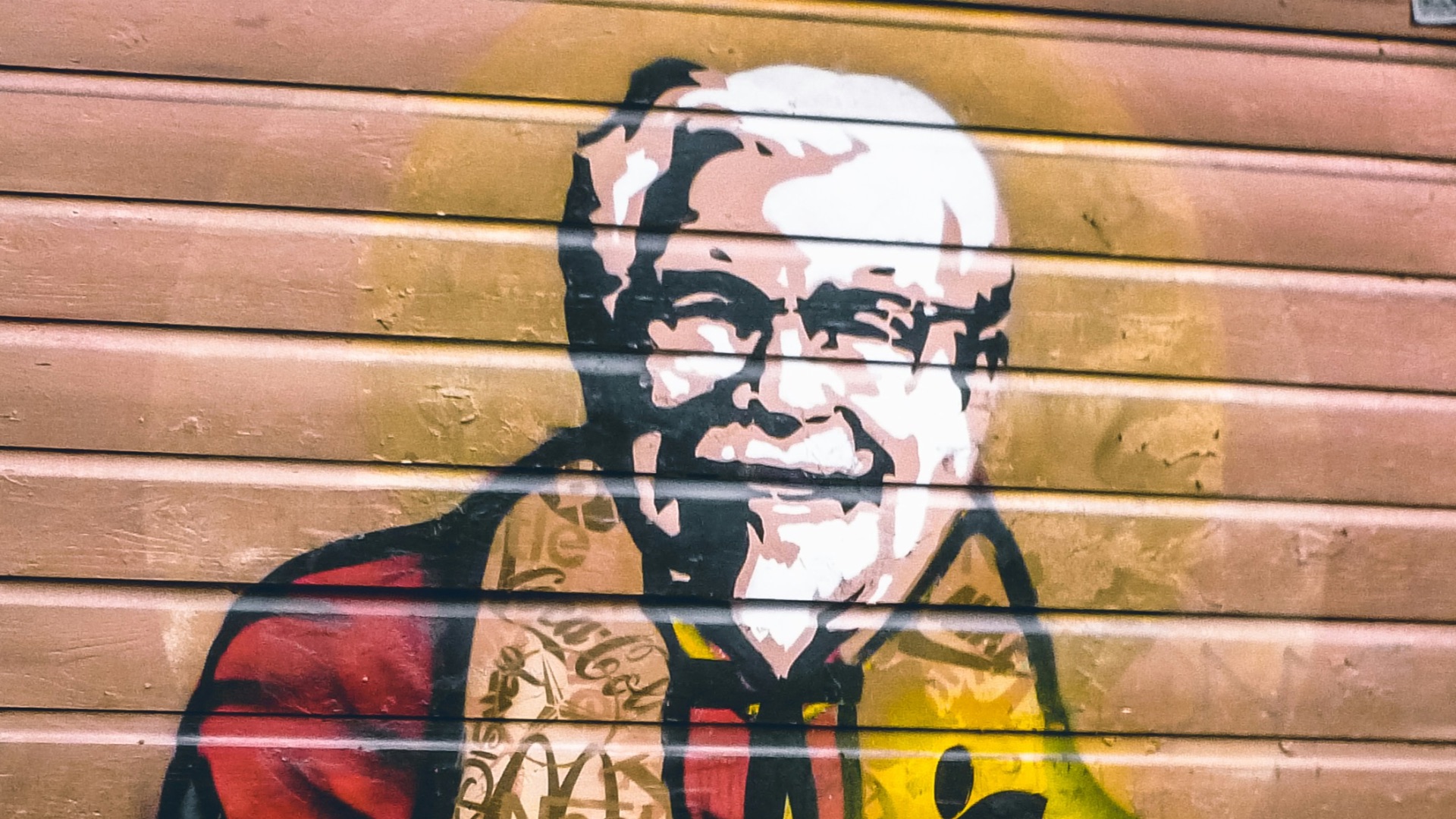 man in black and red scarf and black sunglasses graffiti