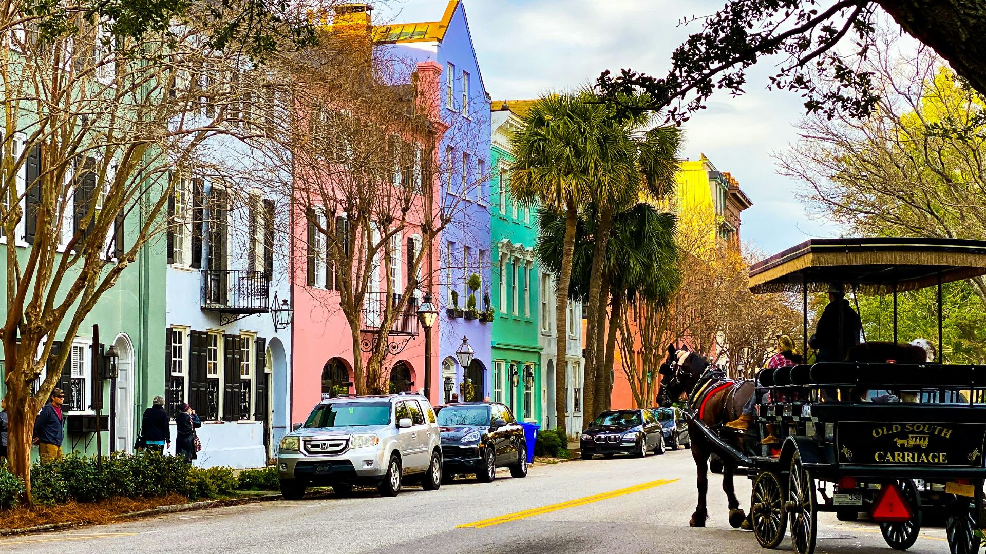 people riding on carriage on road during daytime
