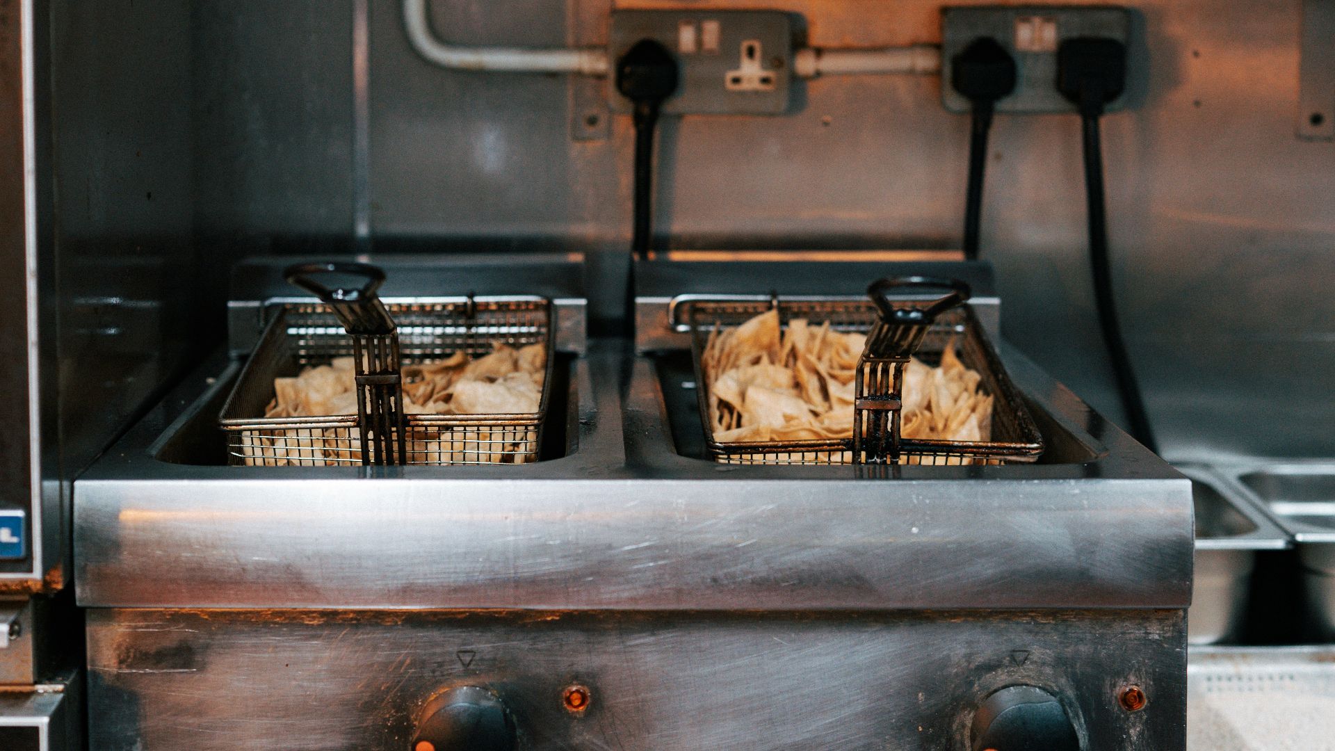 A commercial kitchen with a lot of food in it