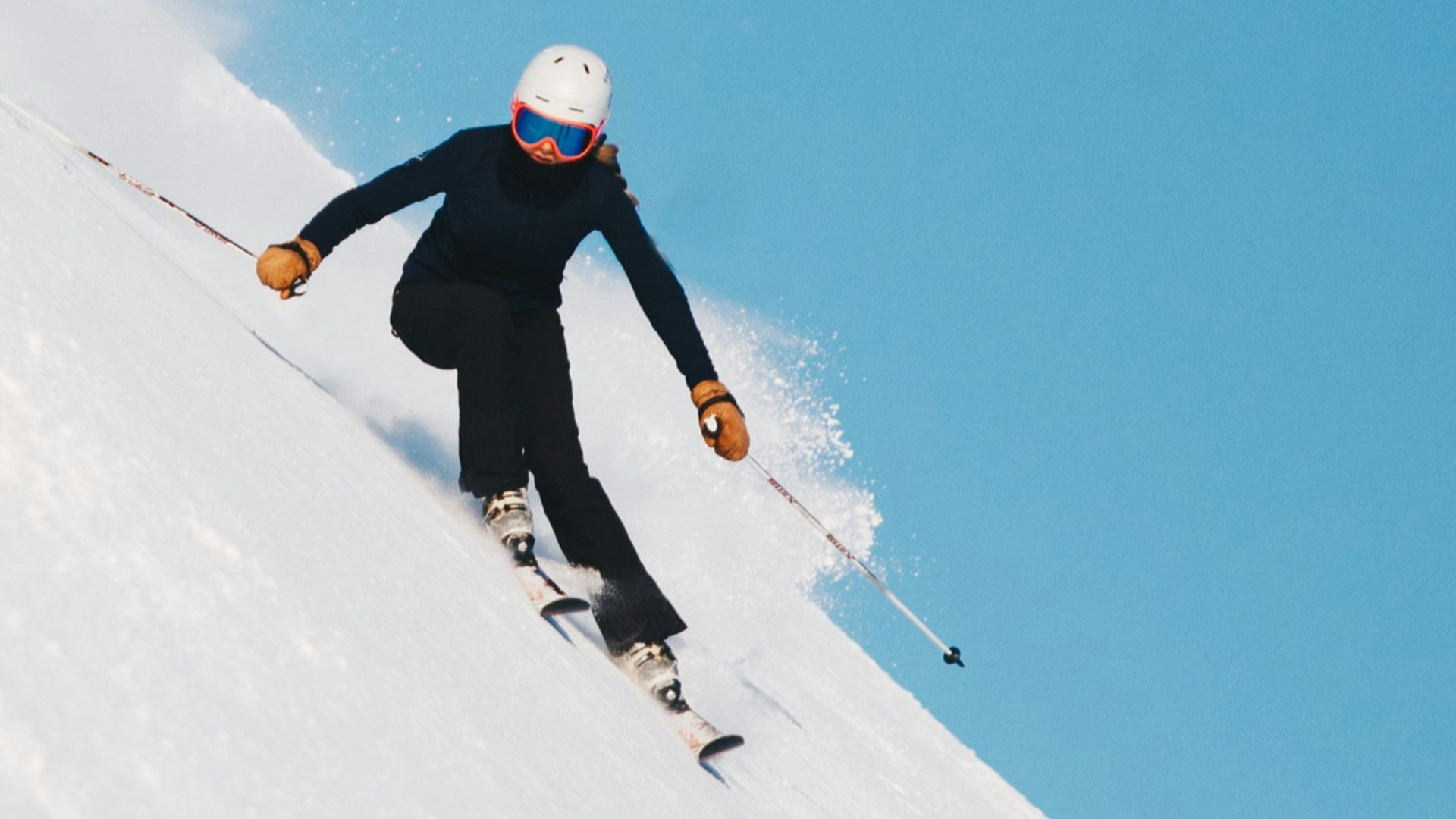 person skiing on snow with gear set