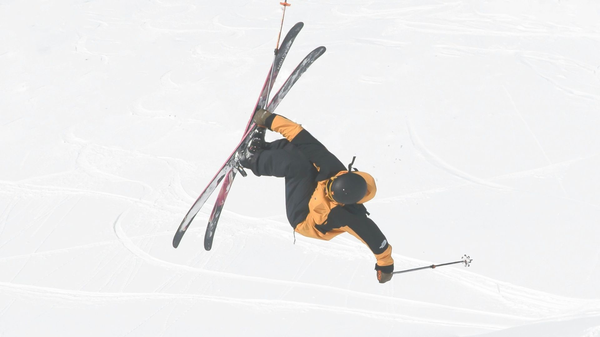 man in black jacket and brown pants doing snow ski during daytime