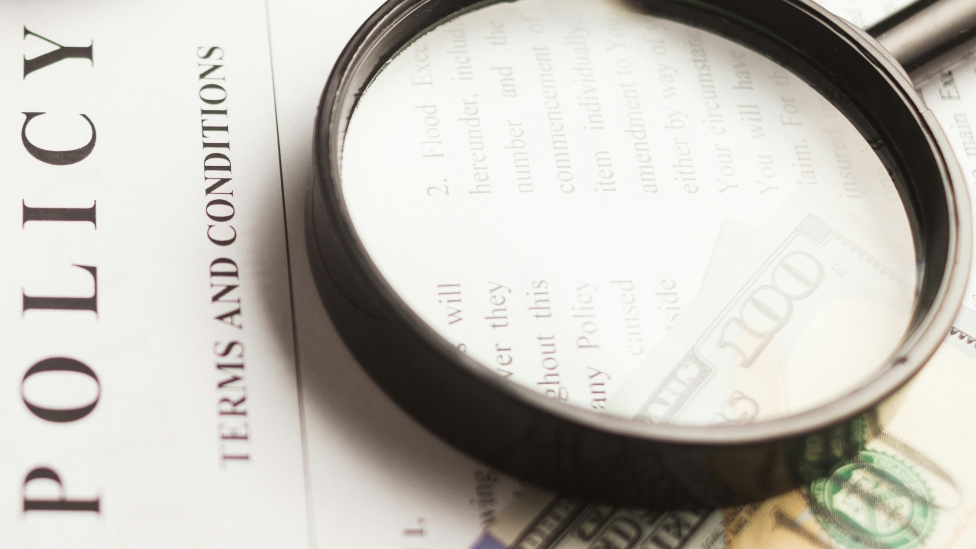 a magnifying glass sitting on top of a piece of paper