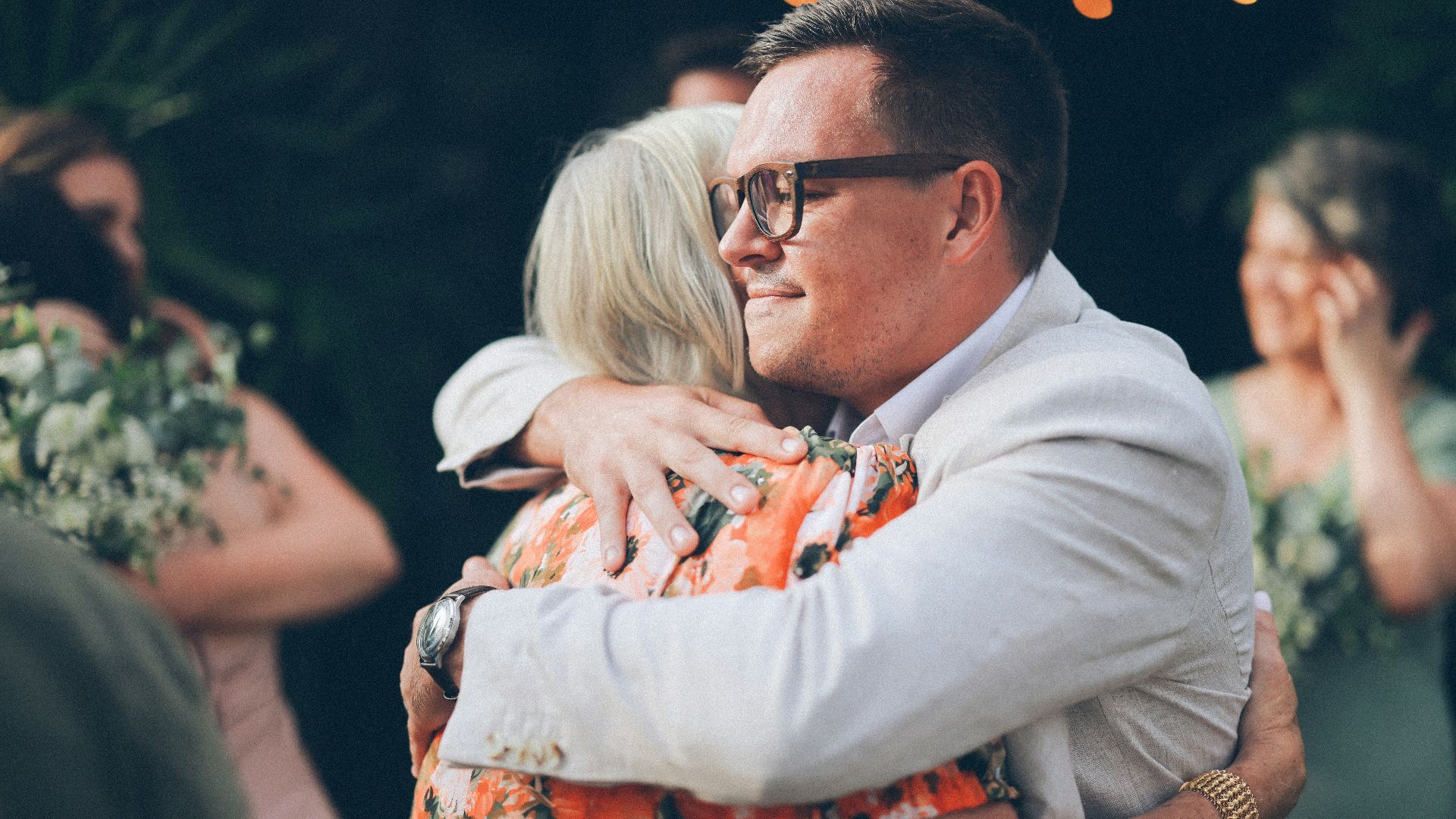 Man hugging a woman at an outdoor event