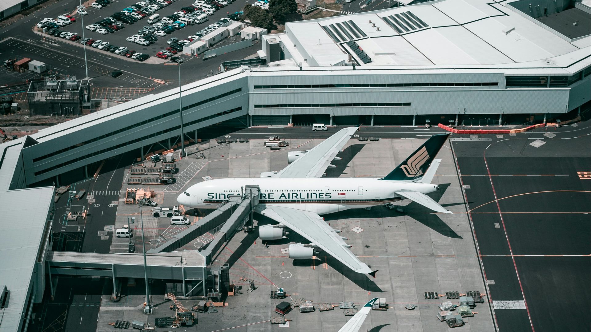 white and gray airplane on airport during daytime