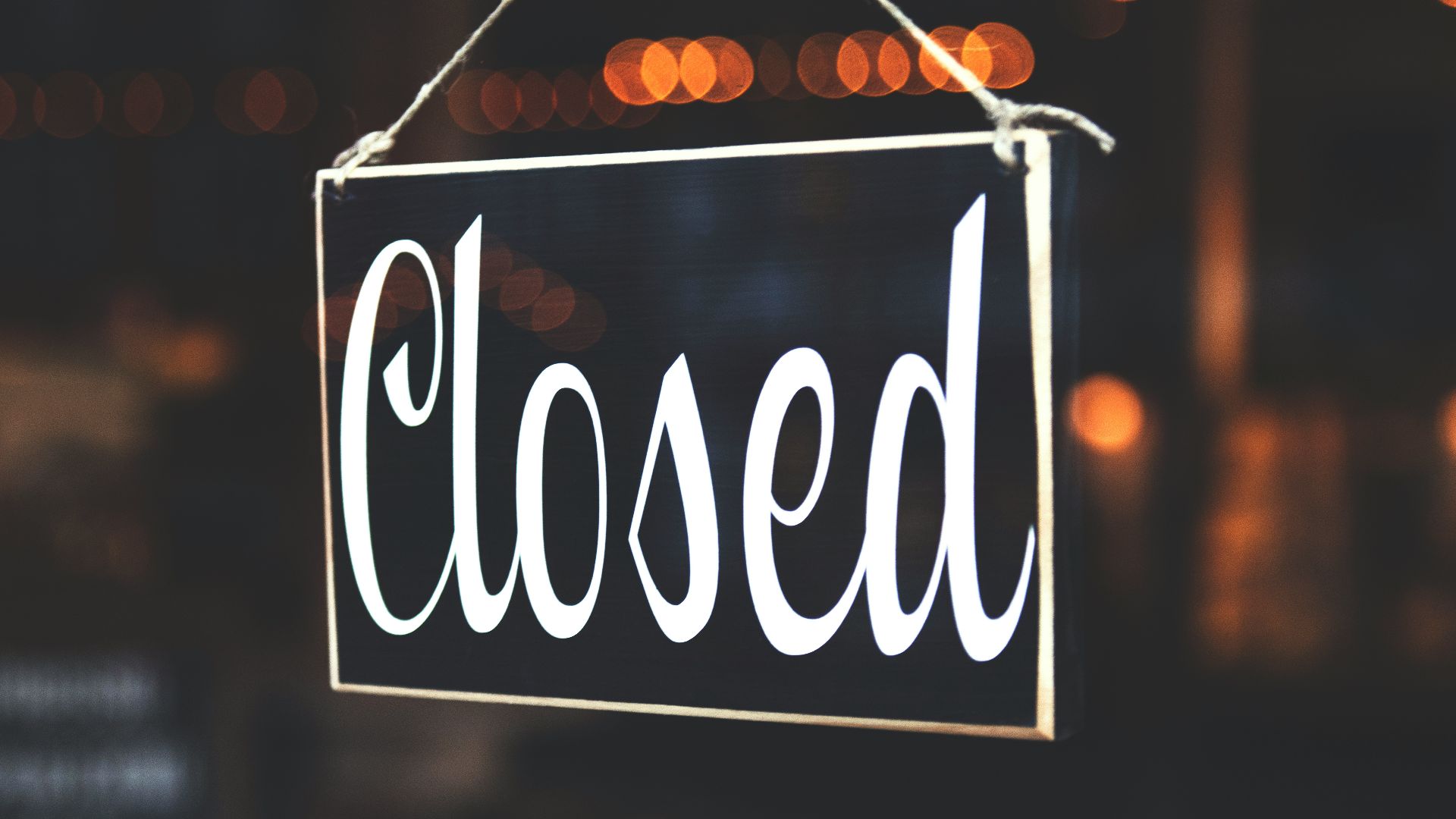 bokeh photography of closed signage