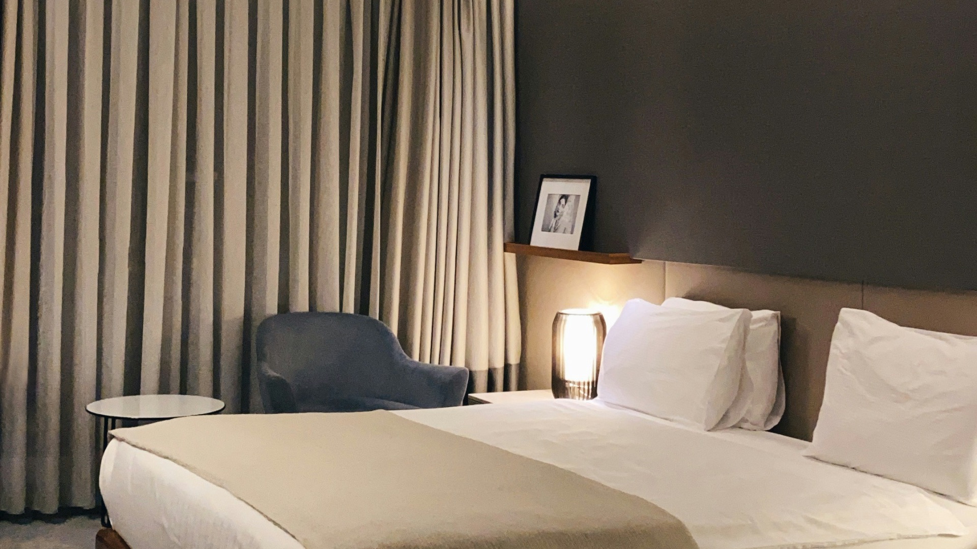 white bed with gray pillow