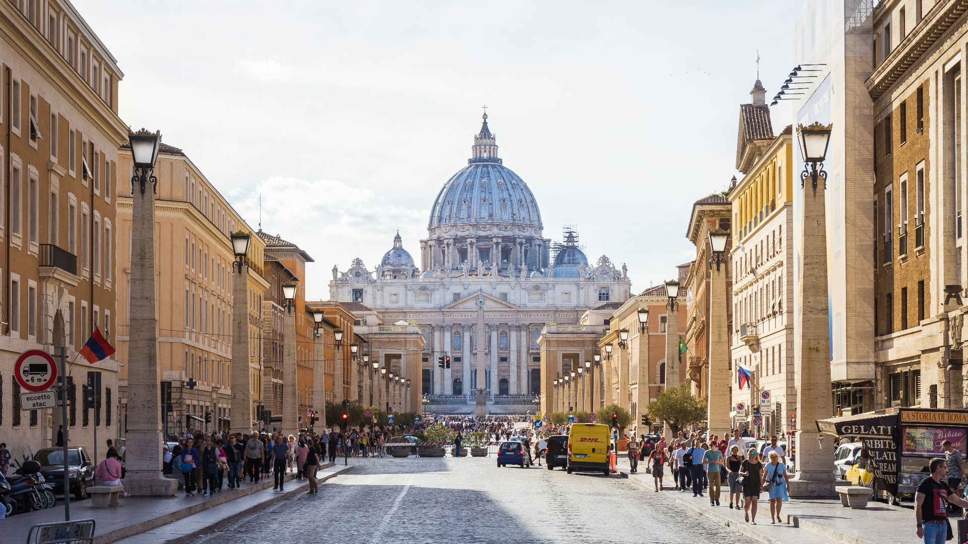 people walking beside white and brown dome building during daytime