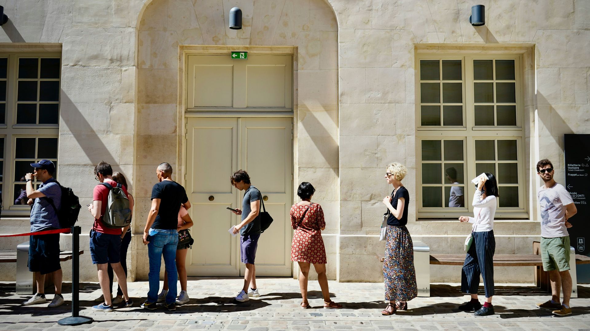 a group of people standing outside a building