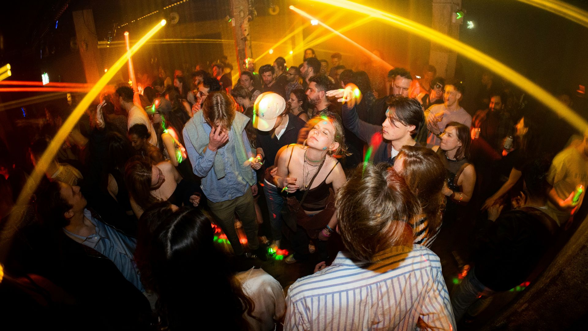 a group of people dancing at a party