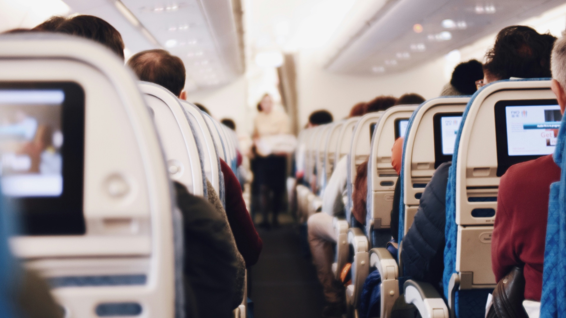 shallow focus photography of people inside of passenger plane