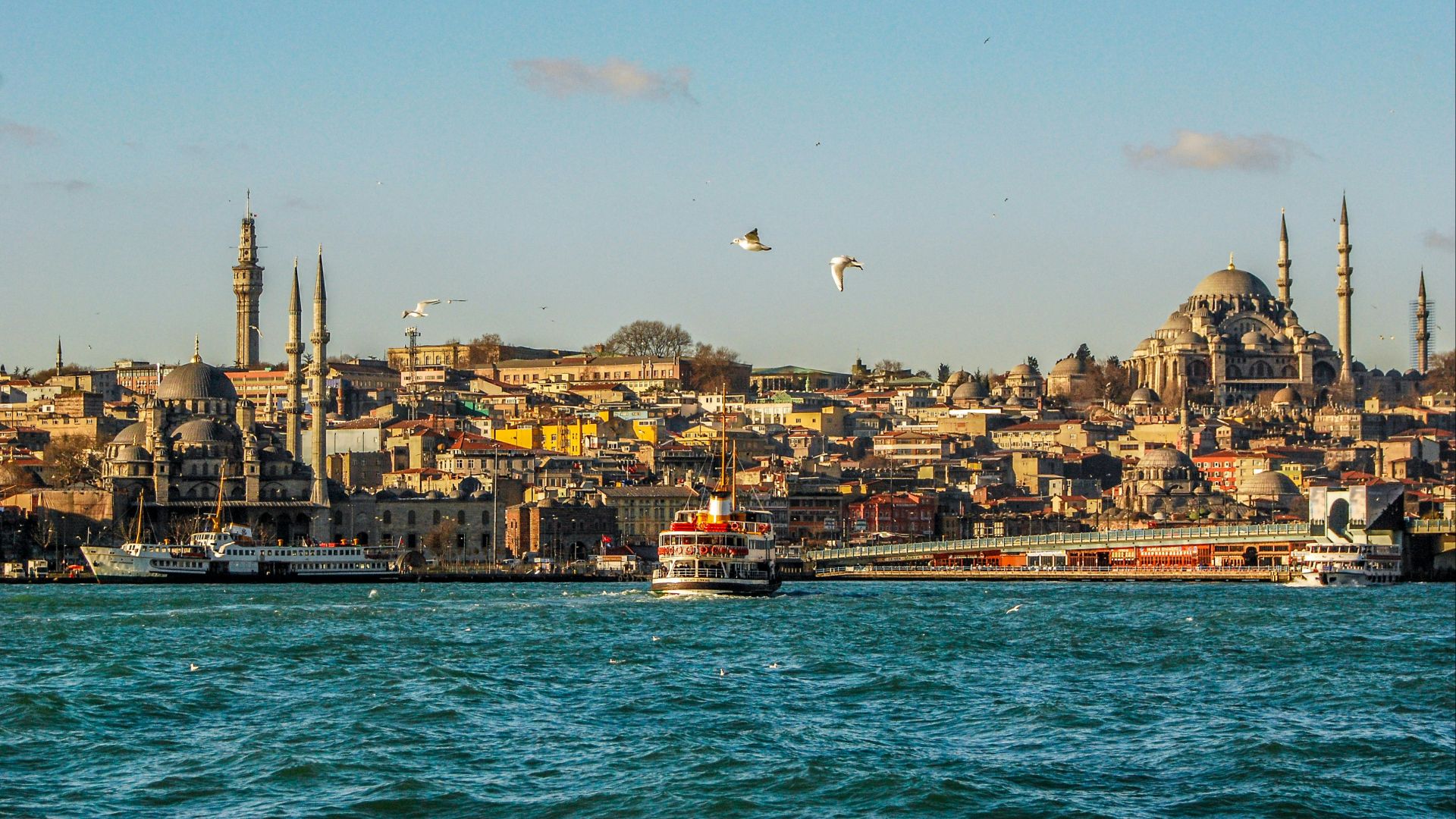 city buildings near body of water during daytime