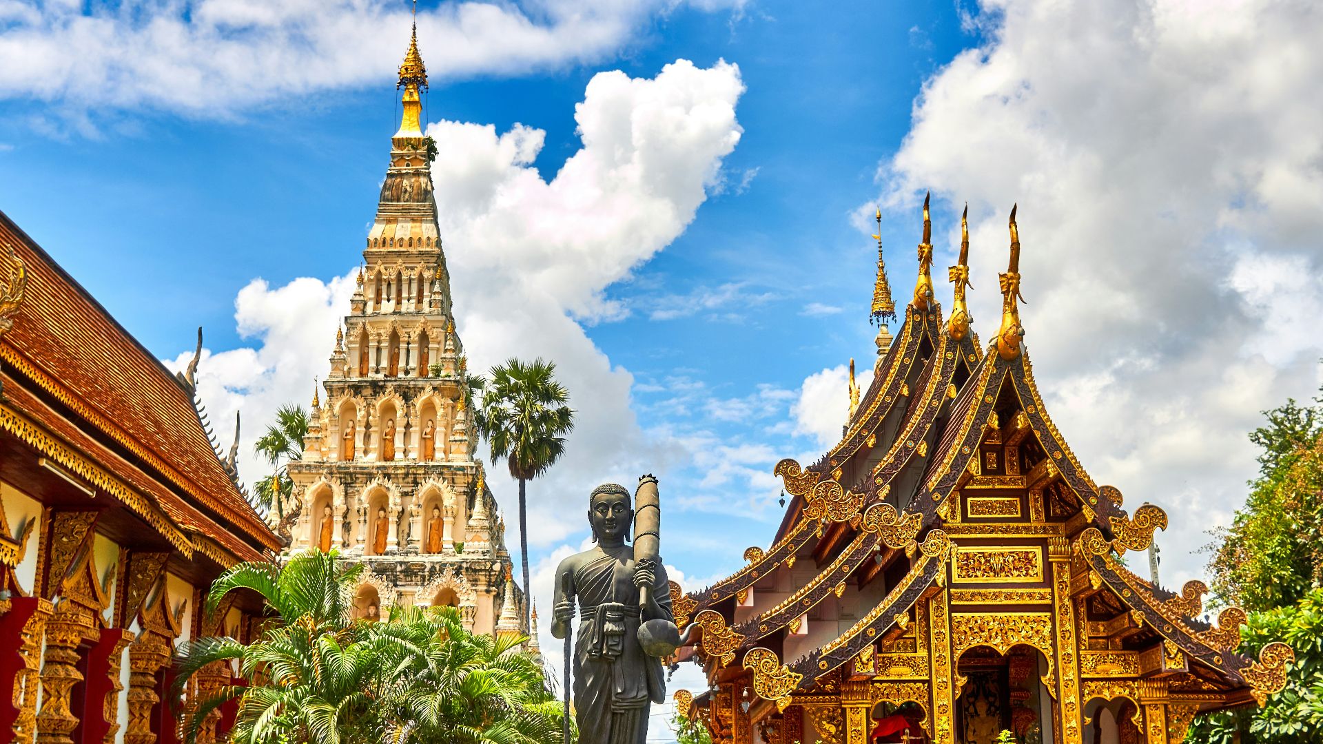 standing statue and temples landmark during daytime