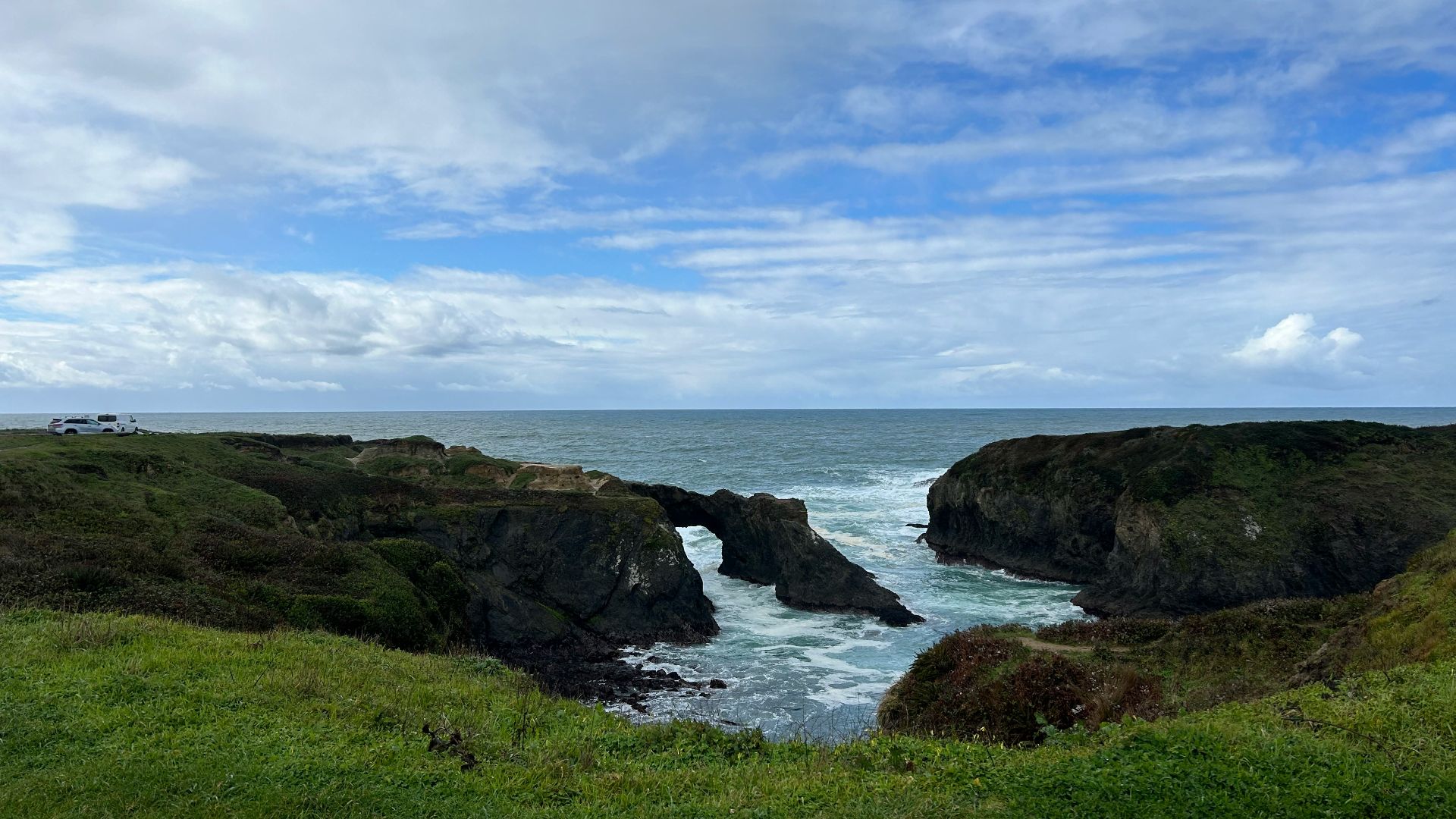 a view of a body of water from a hill