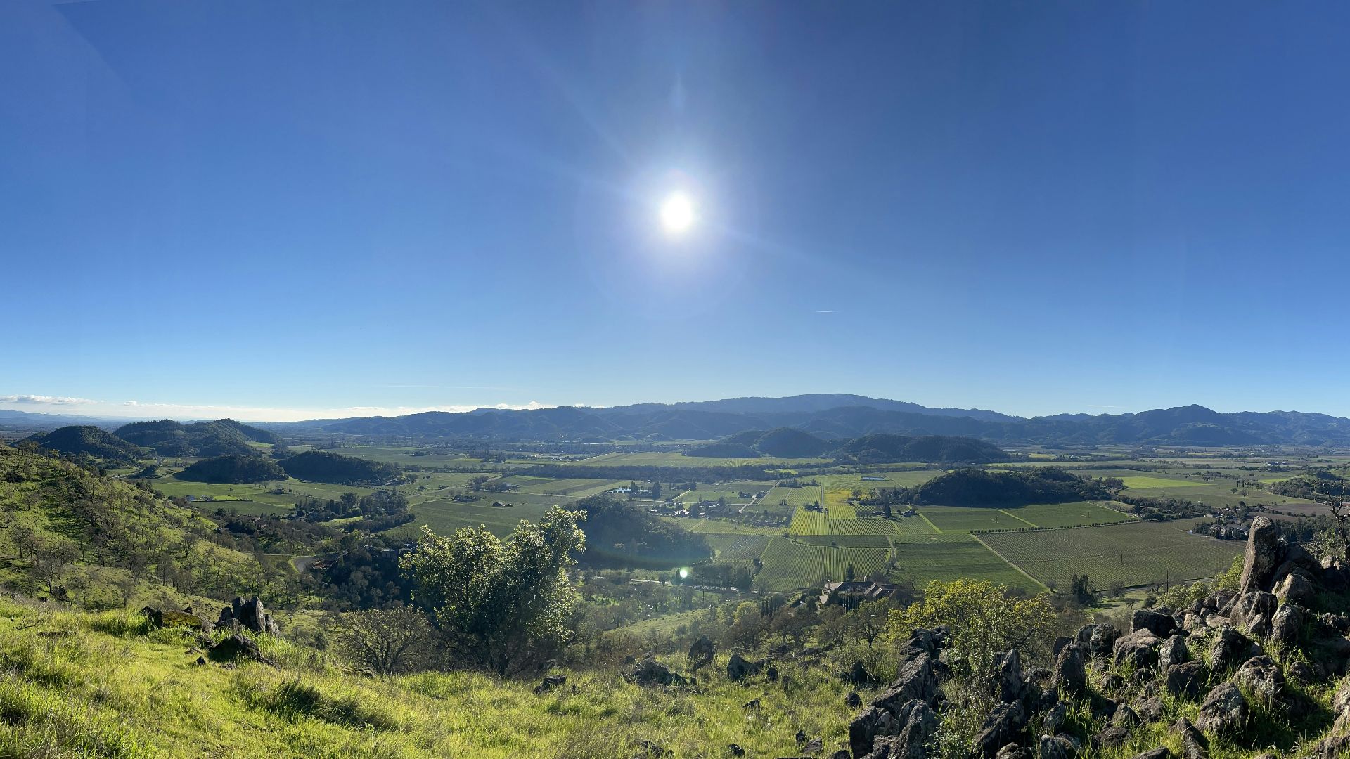 a person standing on a hill overlooking a valley