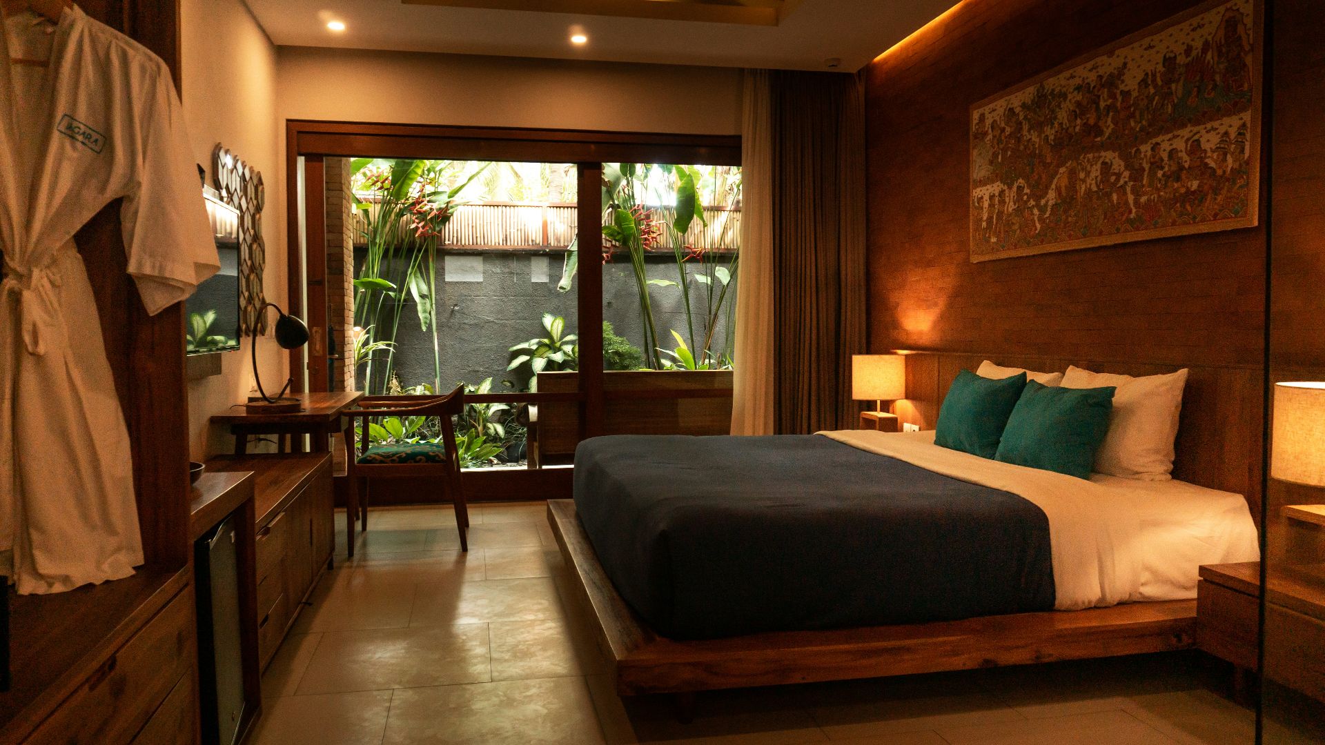 black and white bed near brown wooden table