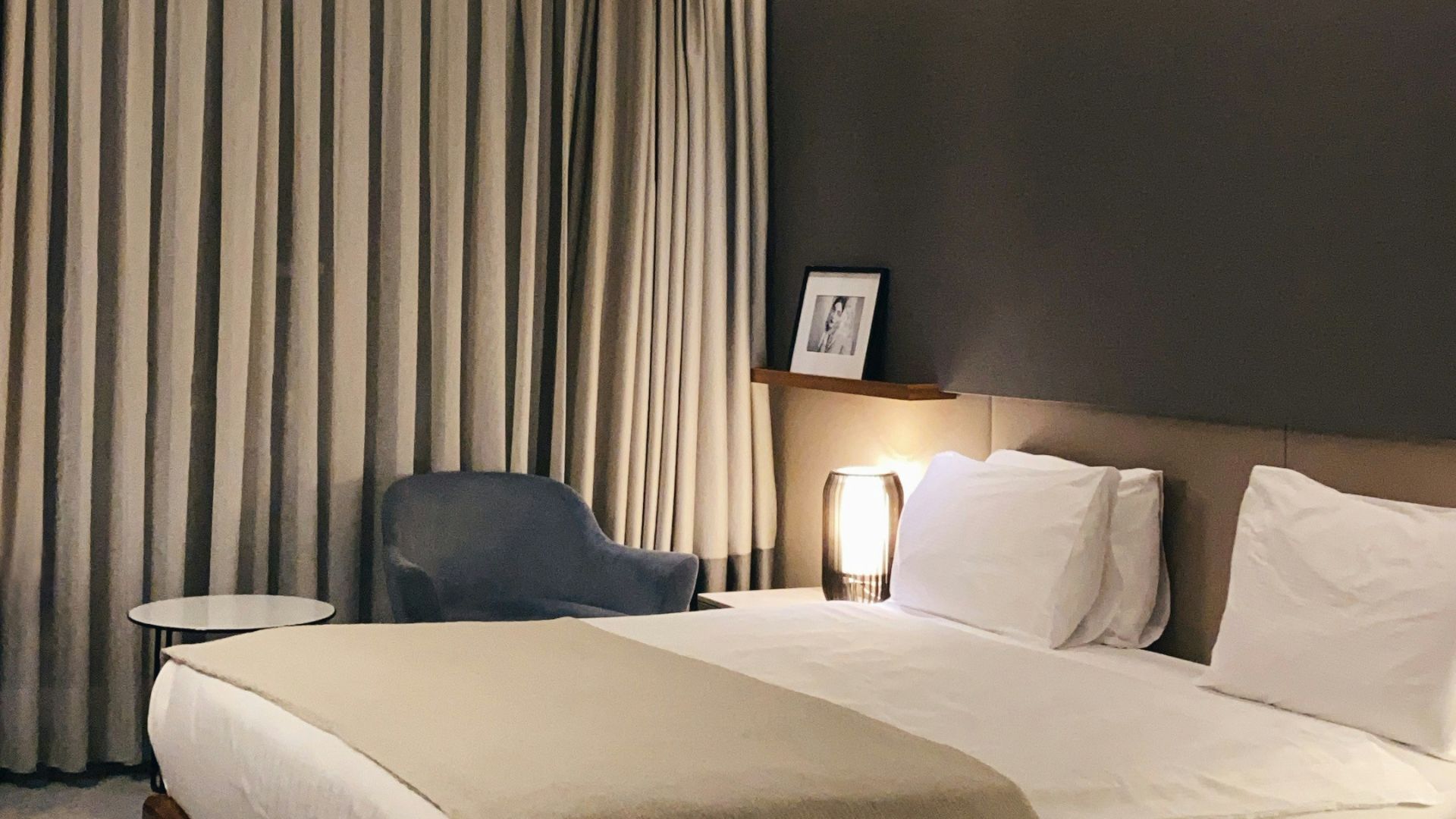 white bed with gray pillow