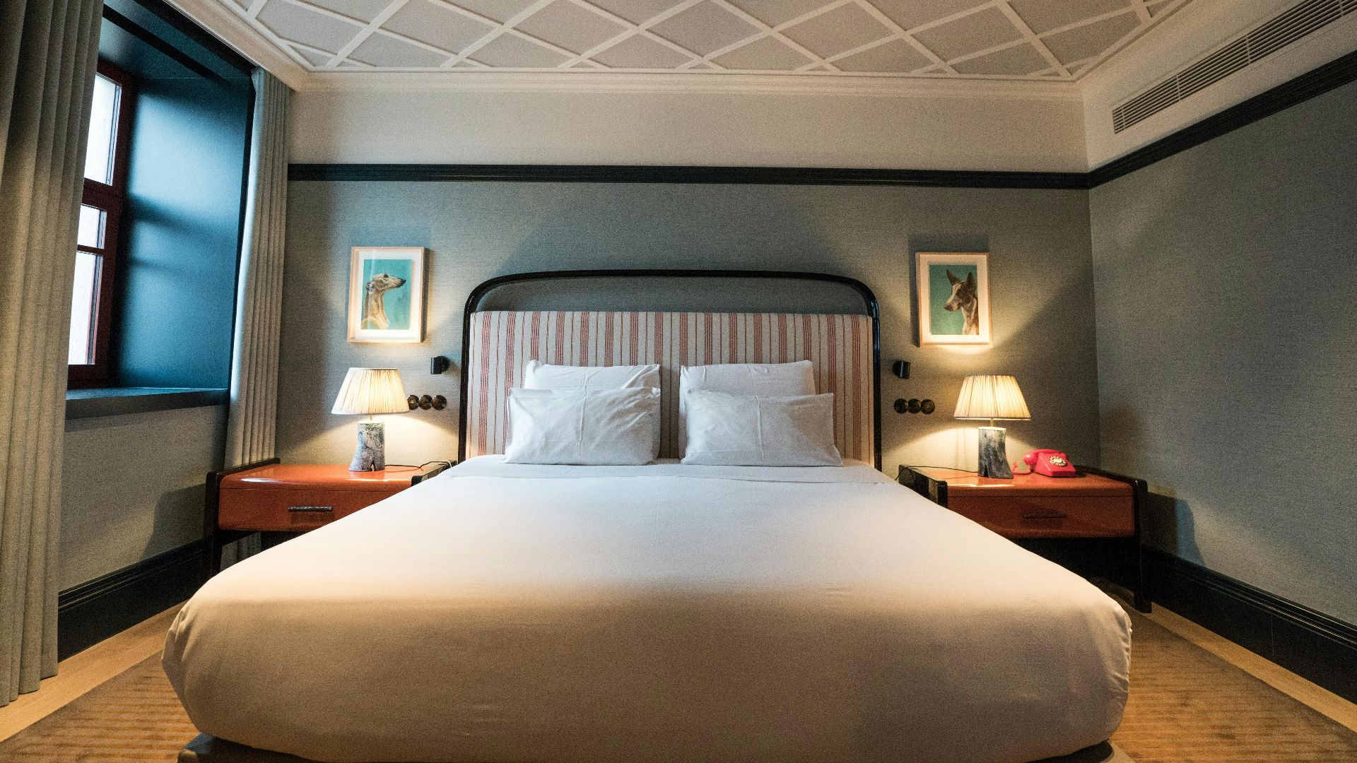 A large bed sitting in a bedroom next to a window