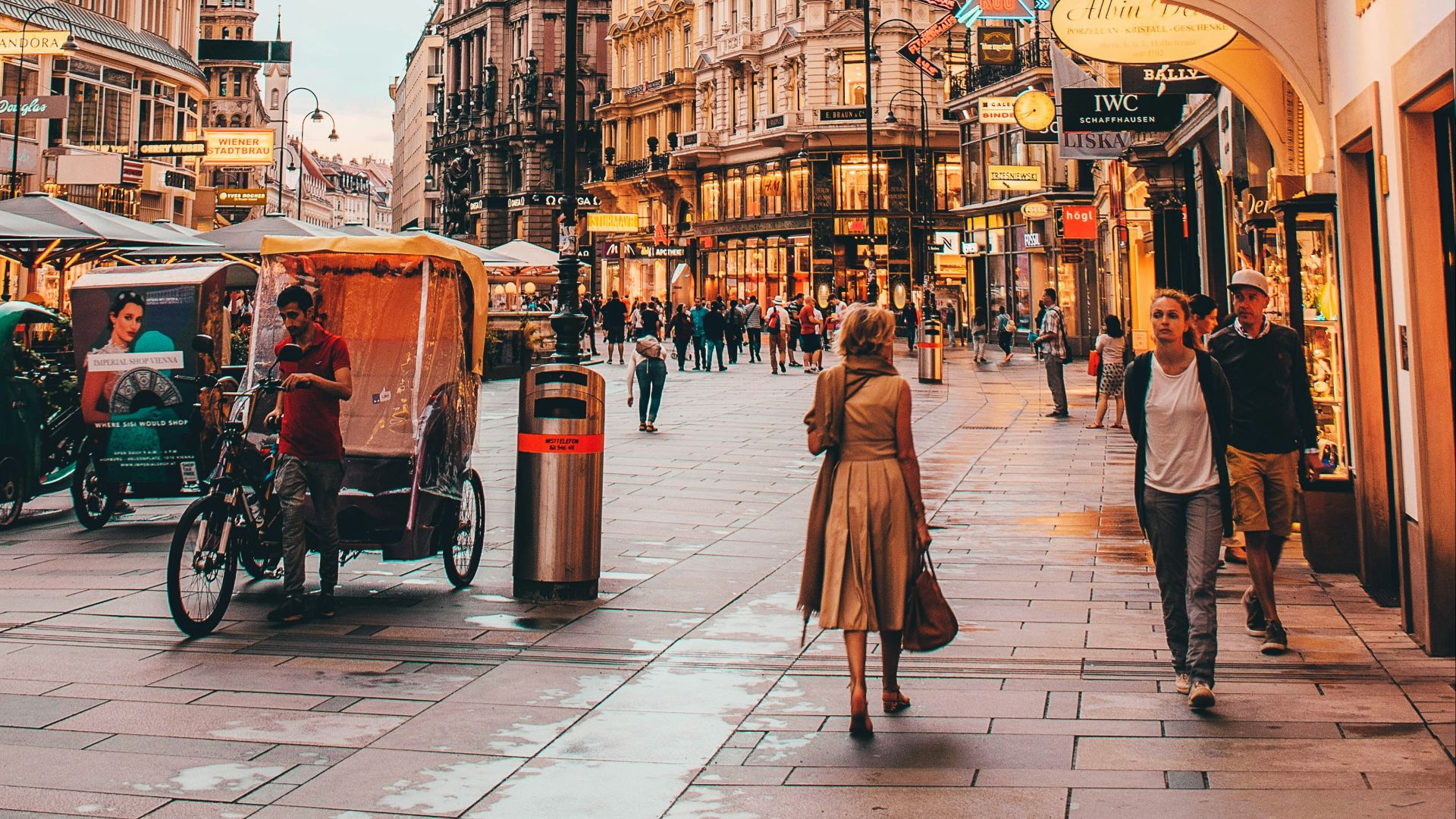 people walking beside Berlitz building during daytime