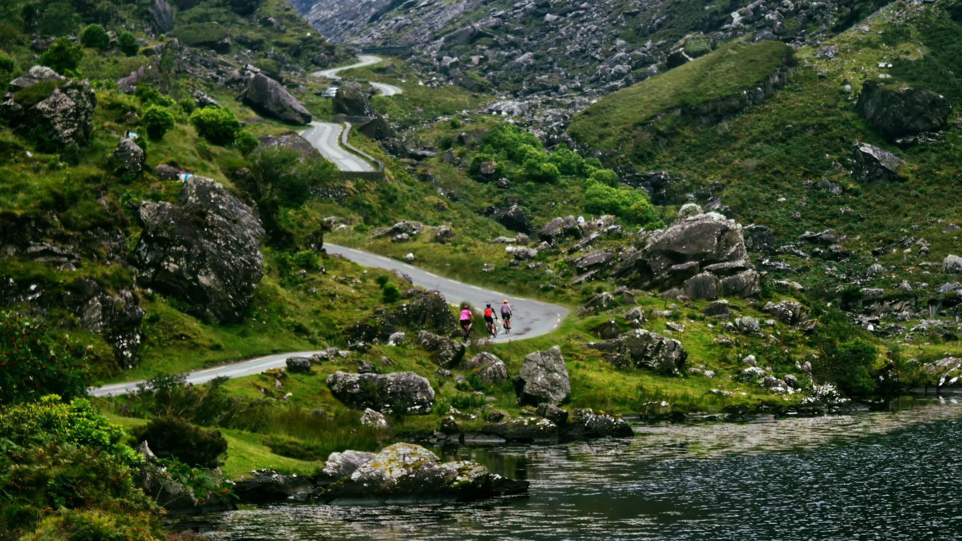 A scenic view of a winding road in the mountains