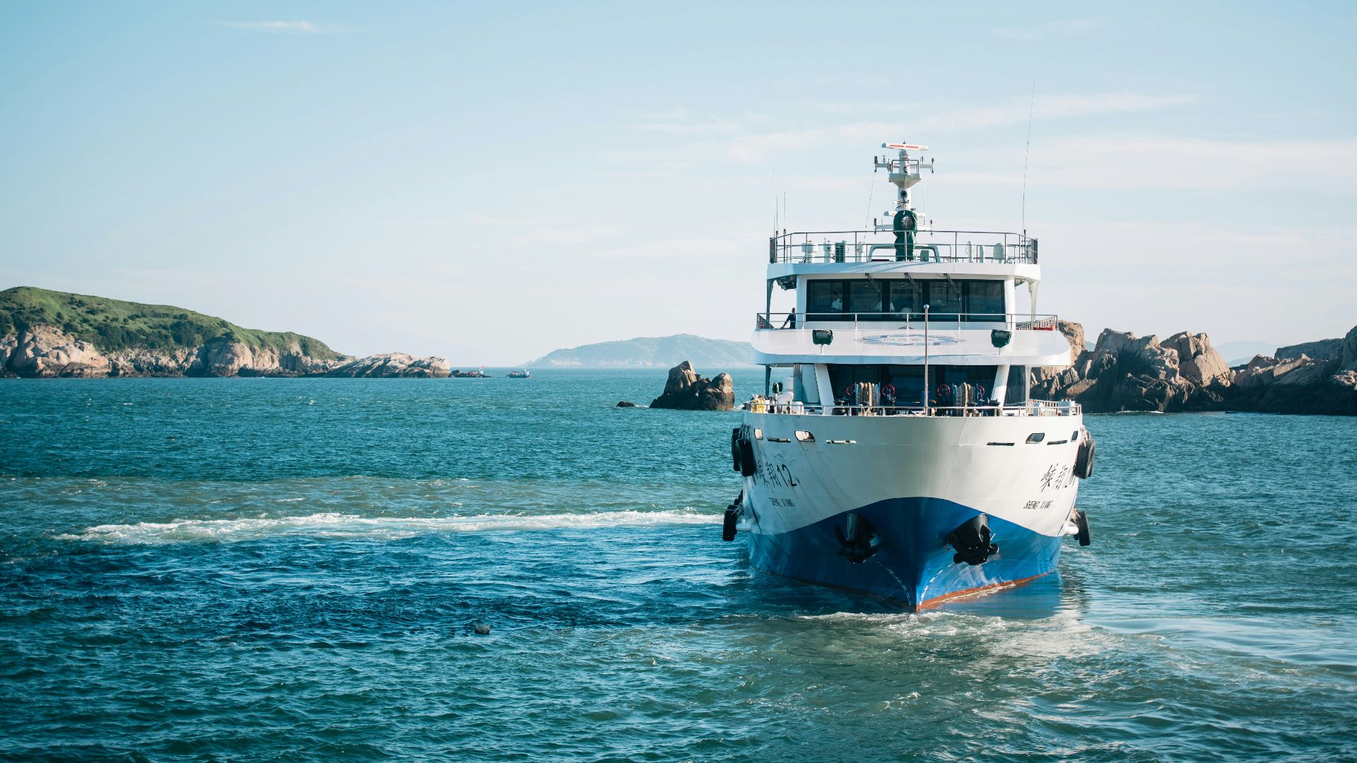 white and blue cruise ship on body of water during daytime