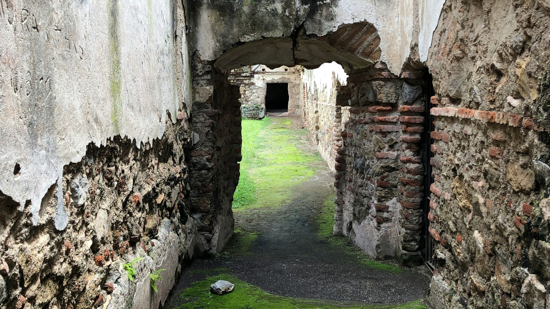 a stone walkway in a stone building