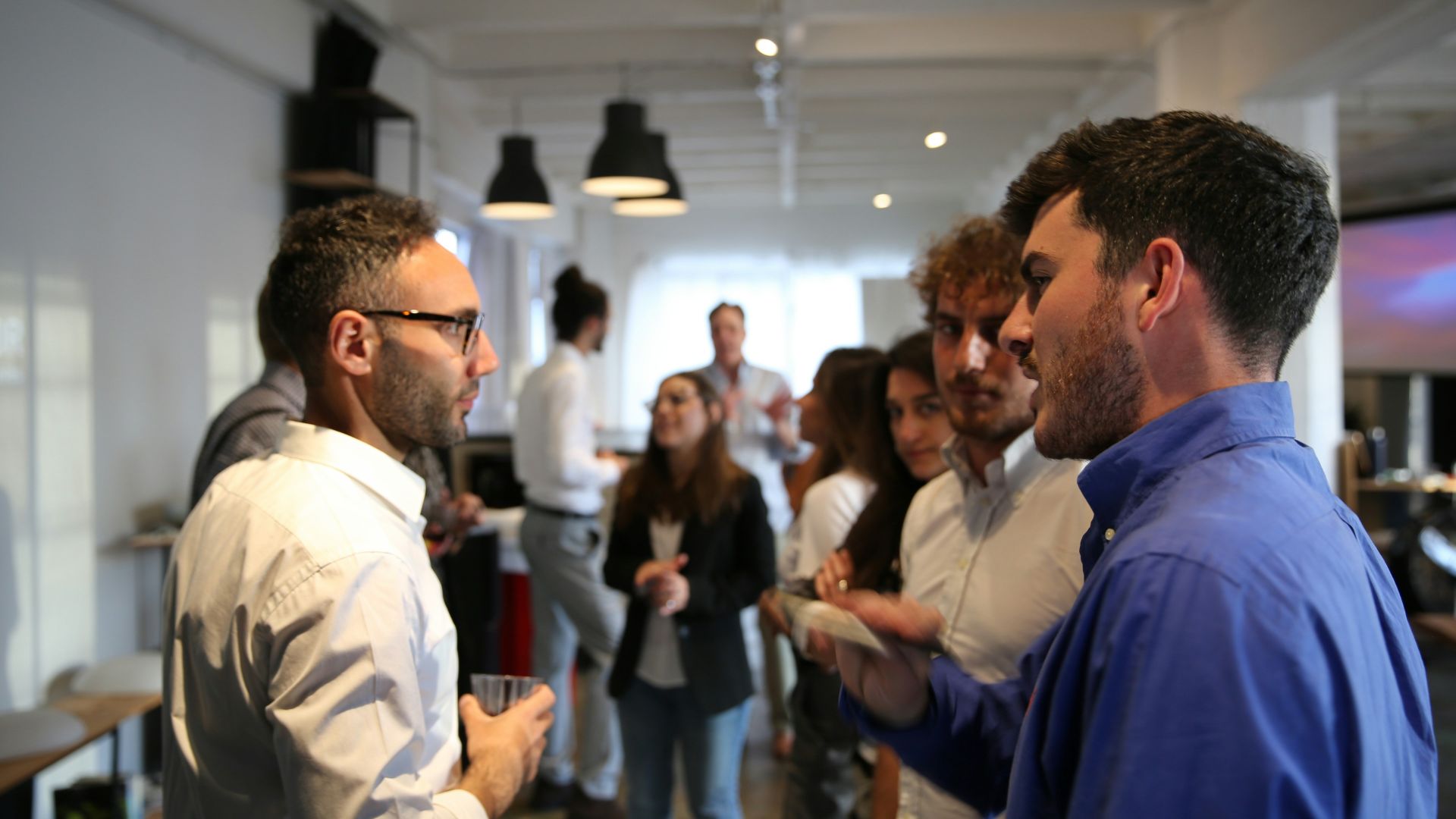 a group of people standing in a room