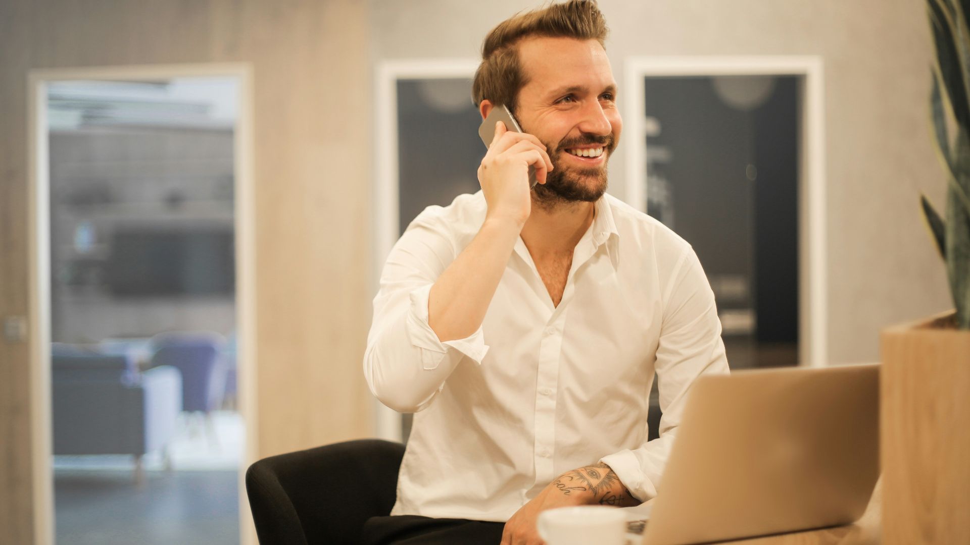 man using smartphone on chair