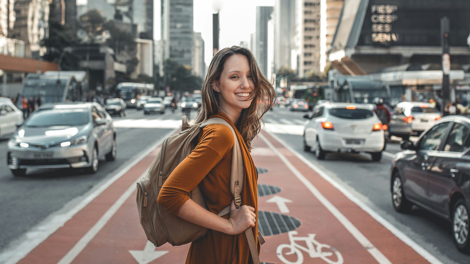 woman standing on middle of road