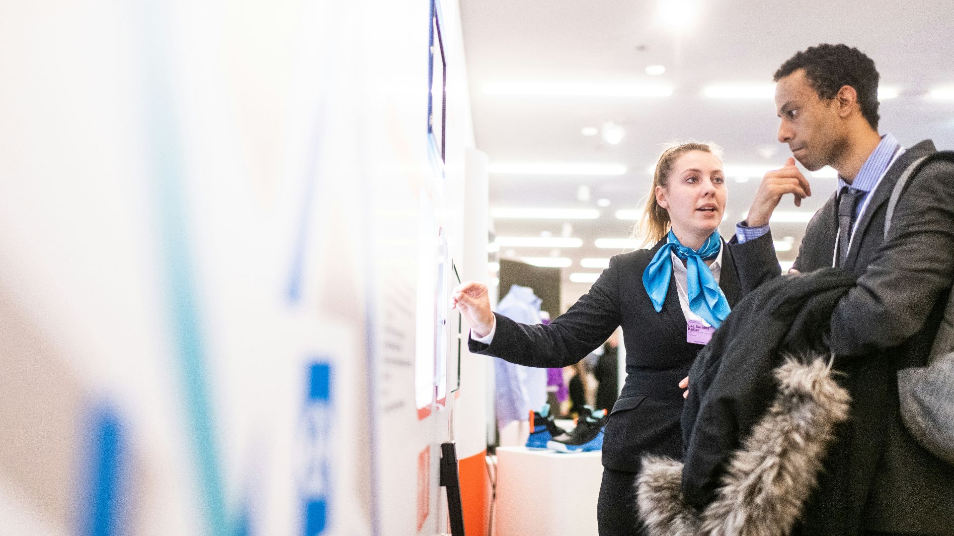 man and woman talking near the wall