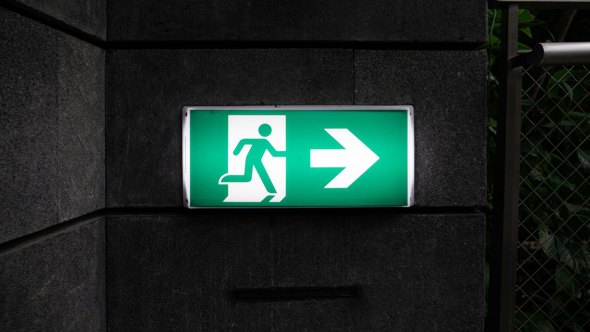 white and green Exit sign