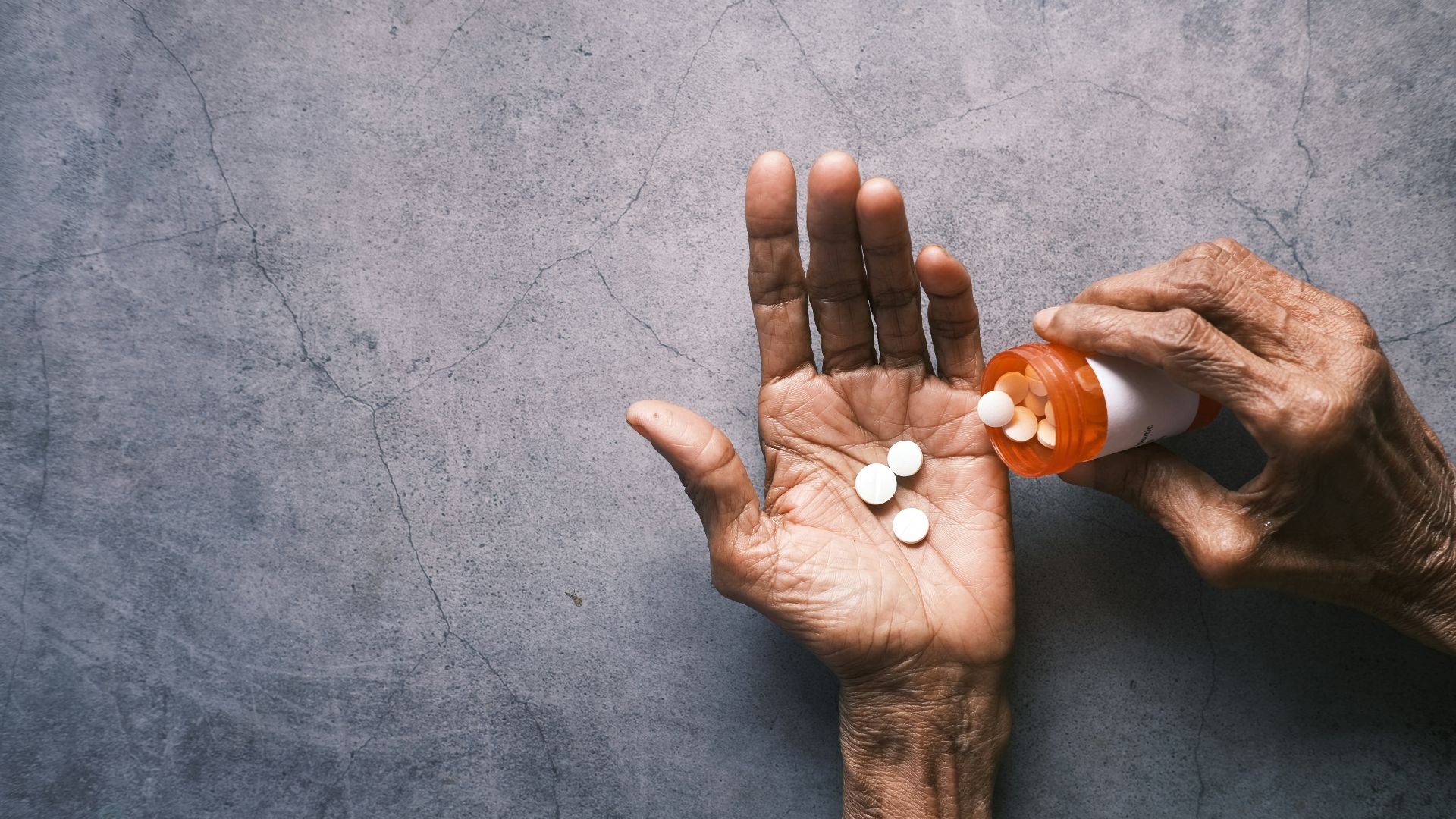 person holding white round ornament
