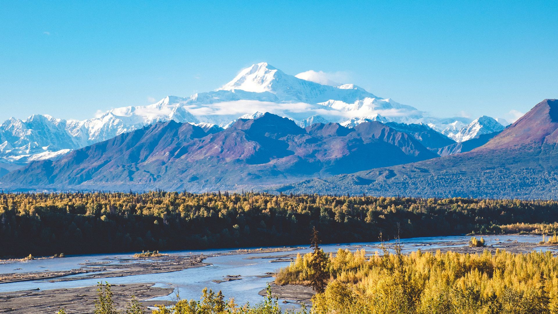 snow covered mountain during daytime
