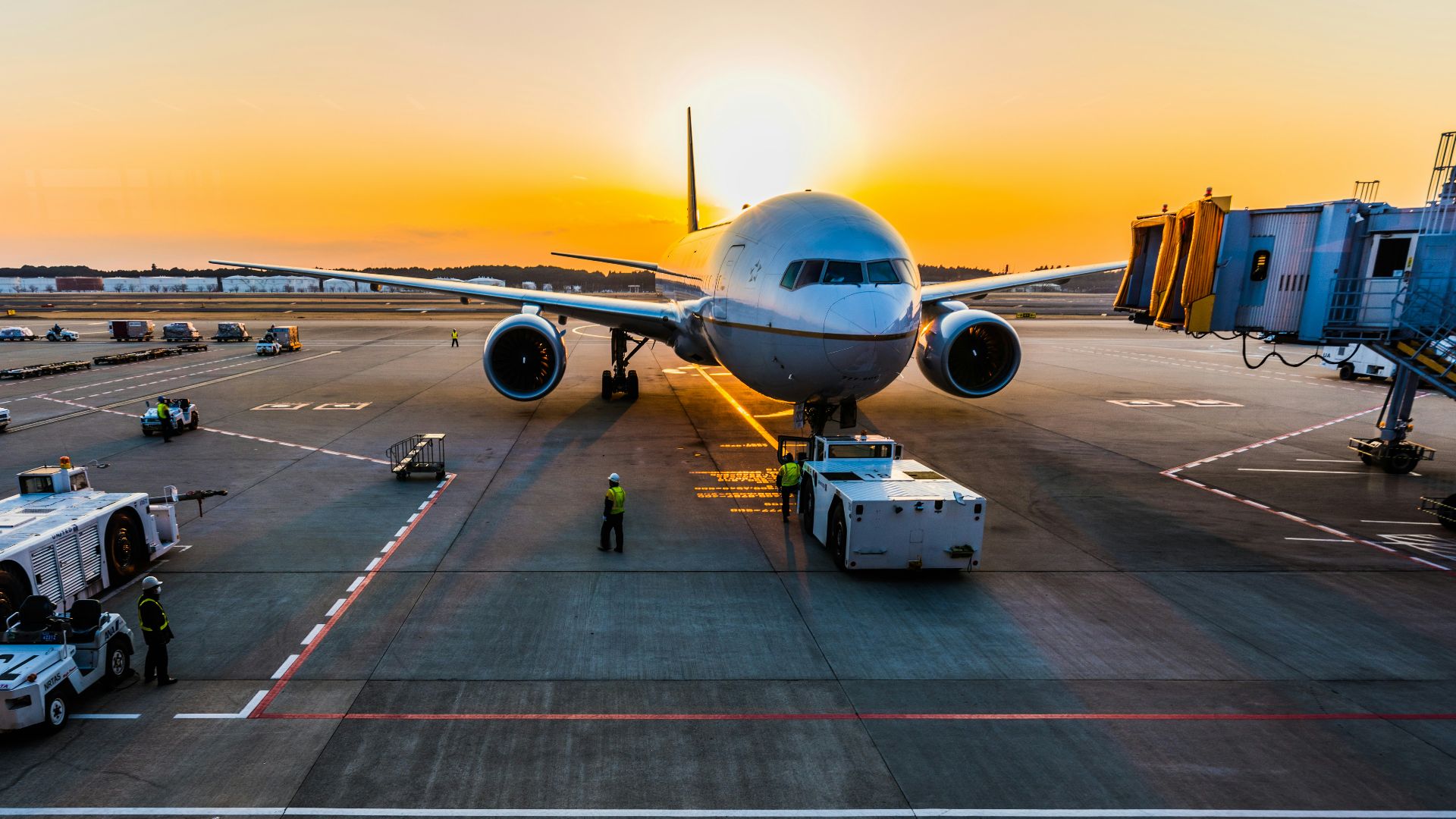 gray airplane on parking