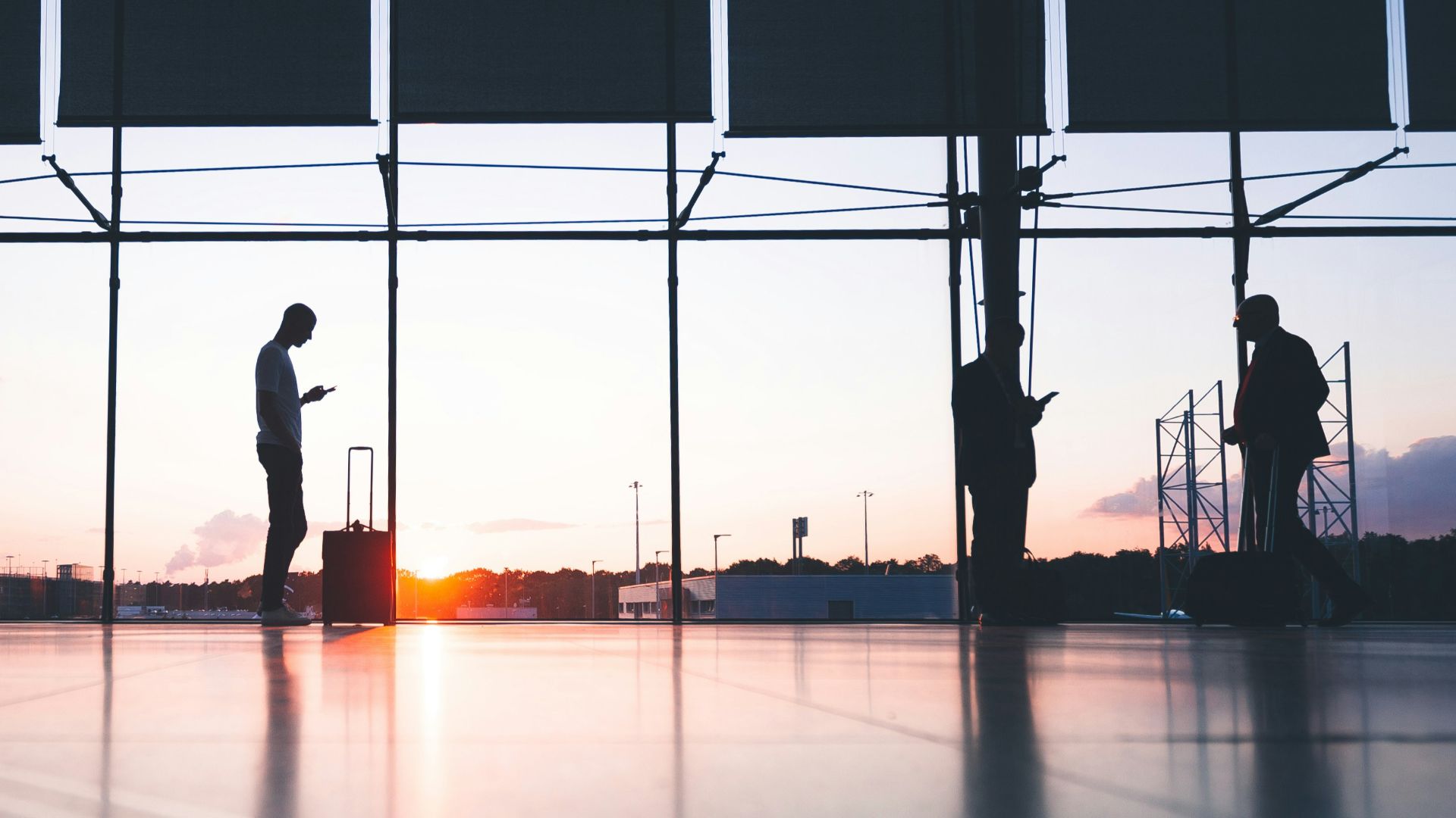silhouette of person across gray clouds