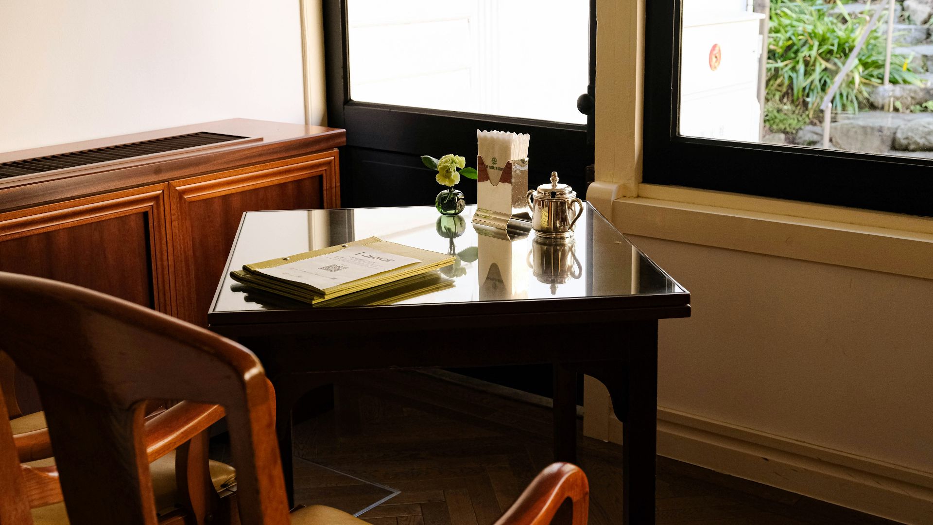 a table with a book and some flowers on it