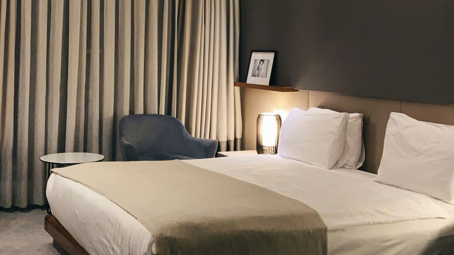 white bed with gray pillow