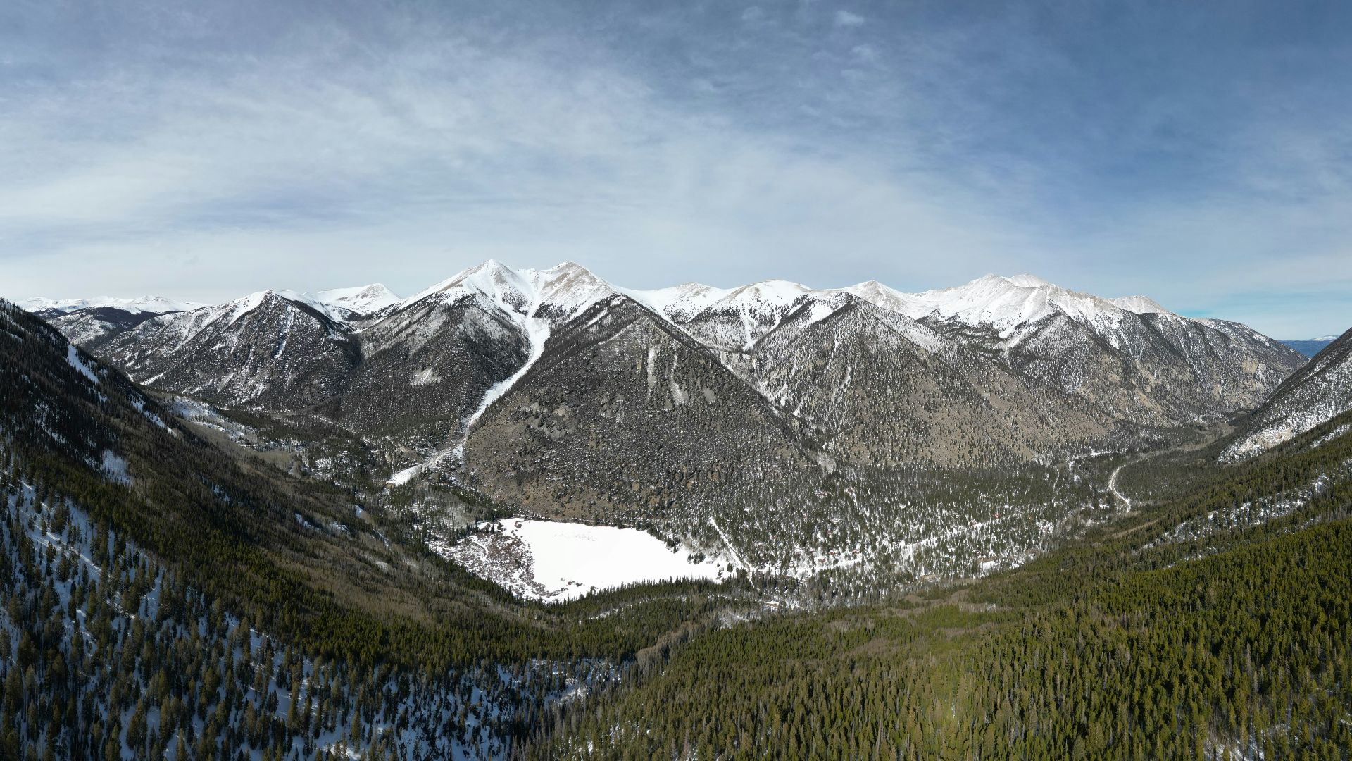 a view of a mountain range with snow on the mountains