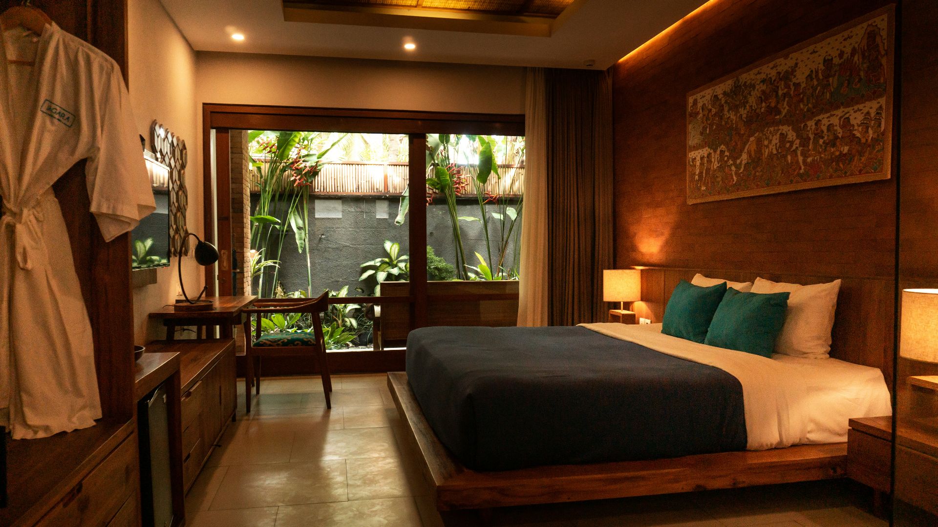 black and white bed near brown wooden table