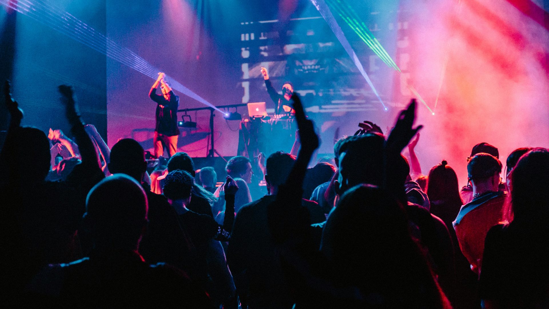 woman singing on stage