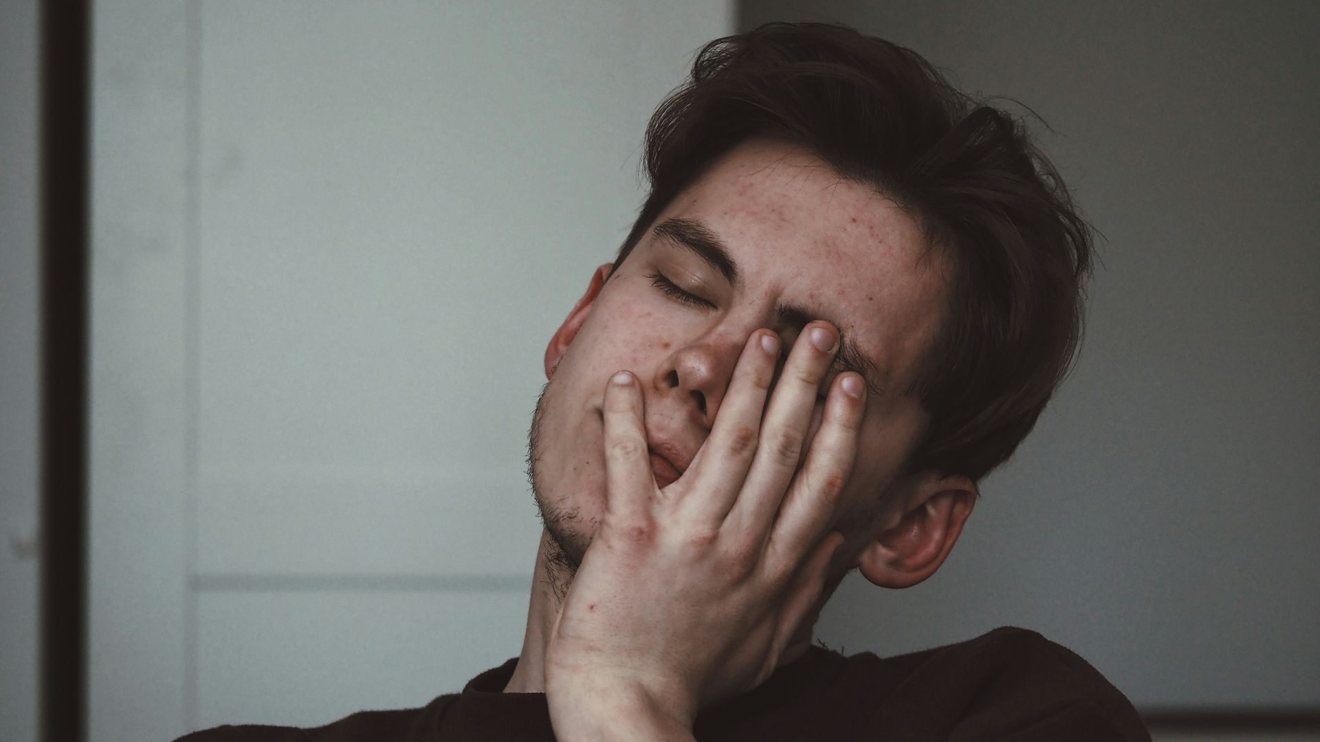 man wearing black crew-neck top