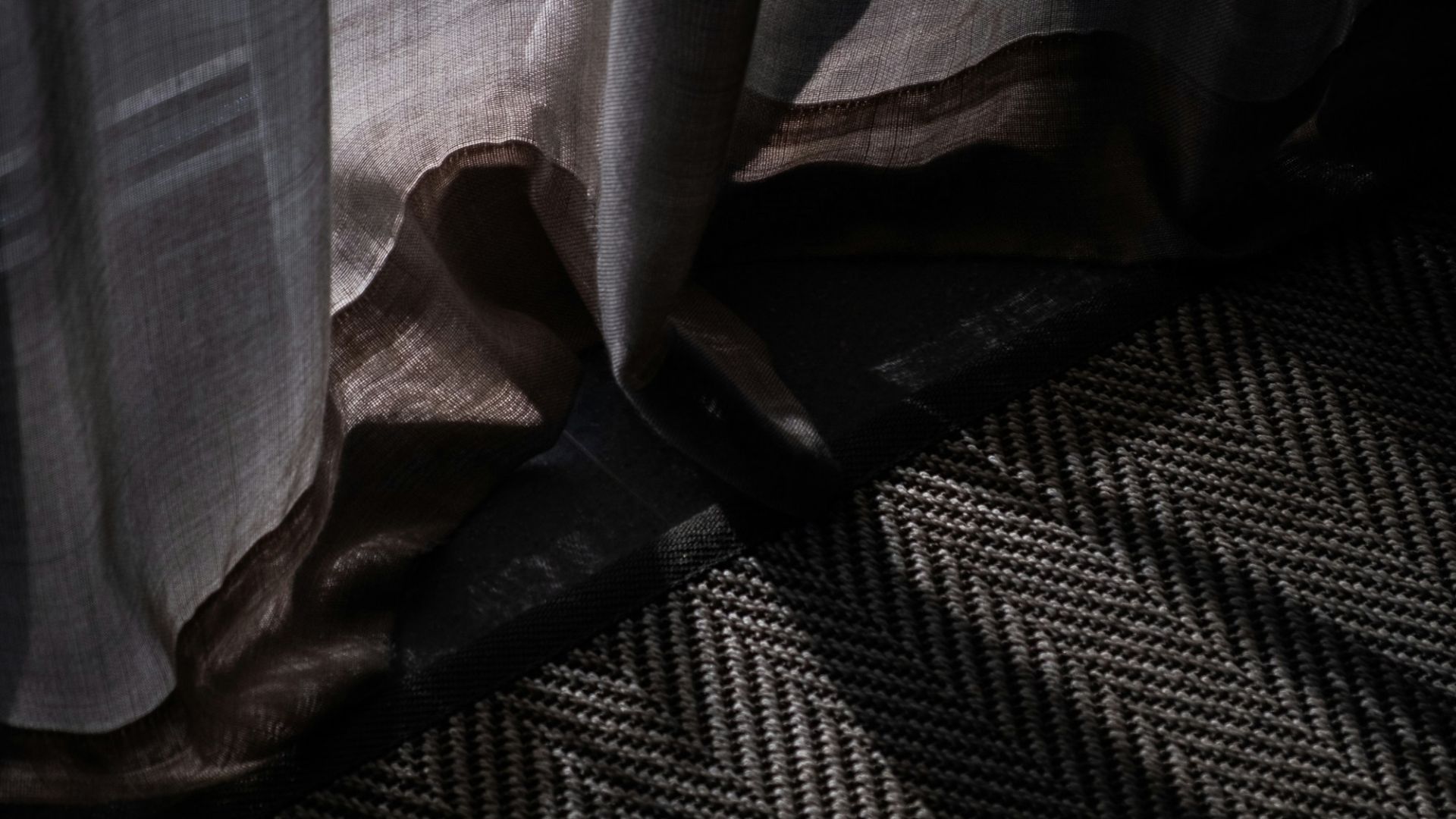 a close up of a window with a curtain