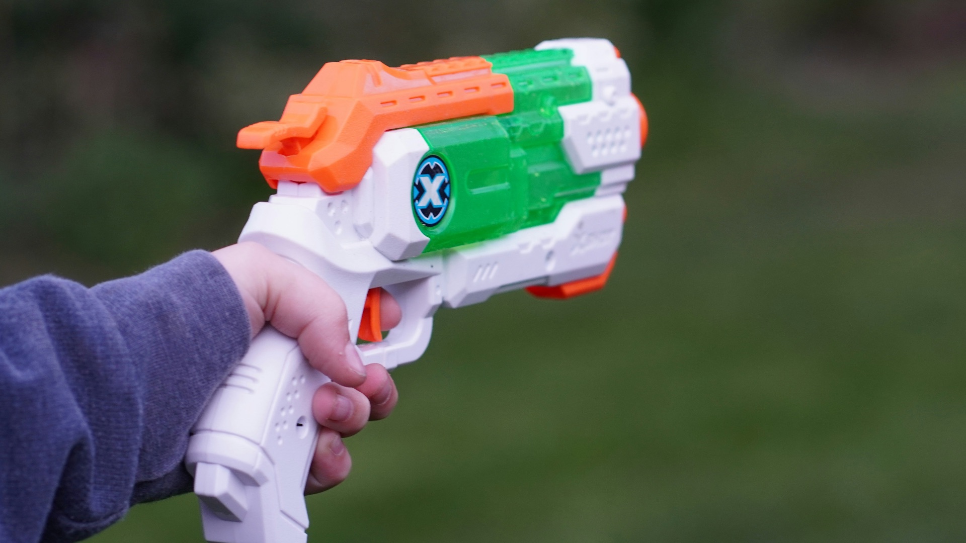 a person holding a toy gun in their hand