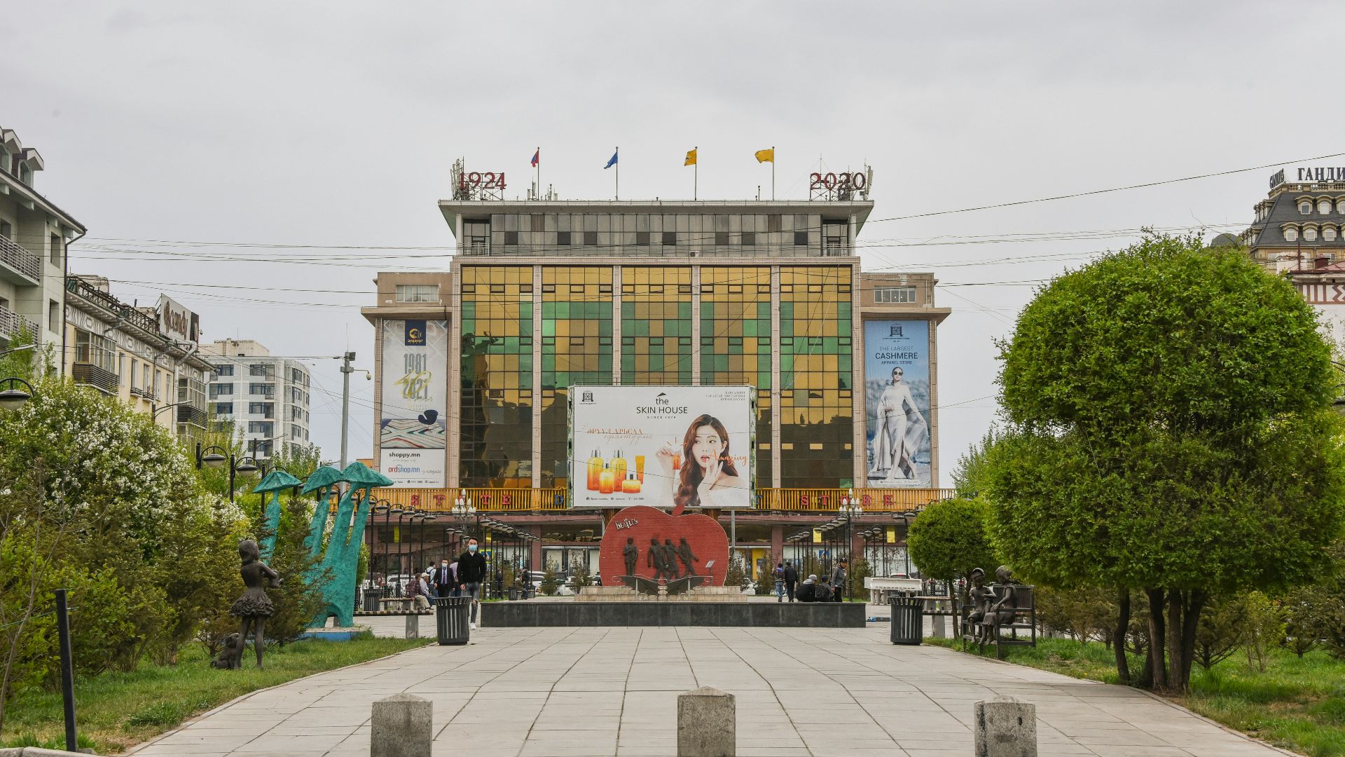 people walking on sidewalk near building during daytime