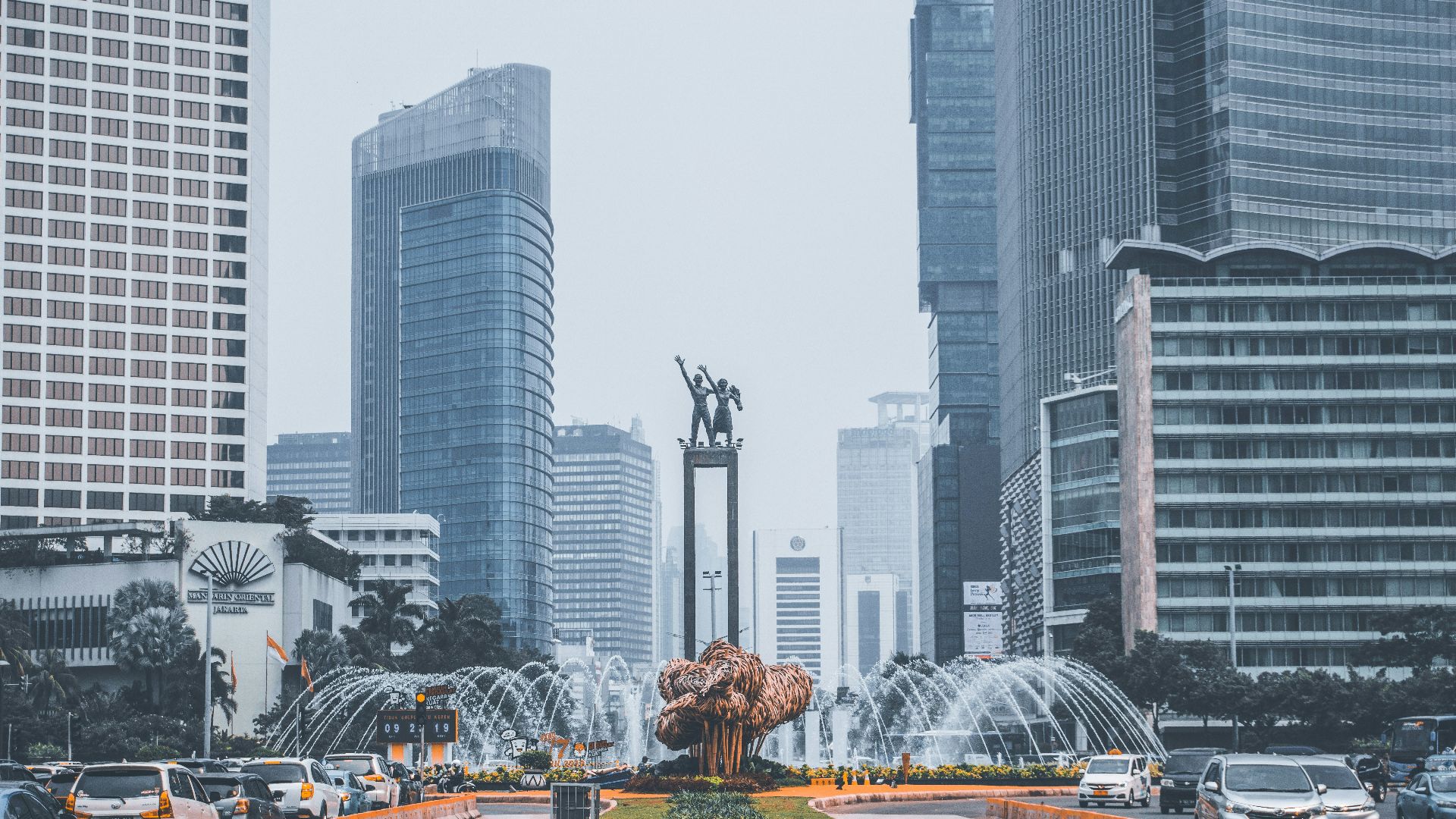park with fountain near buildings