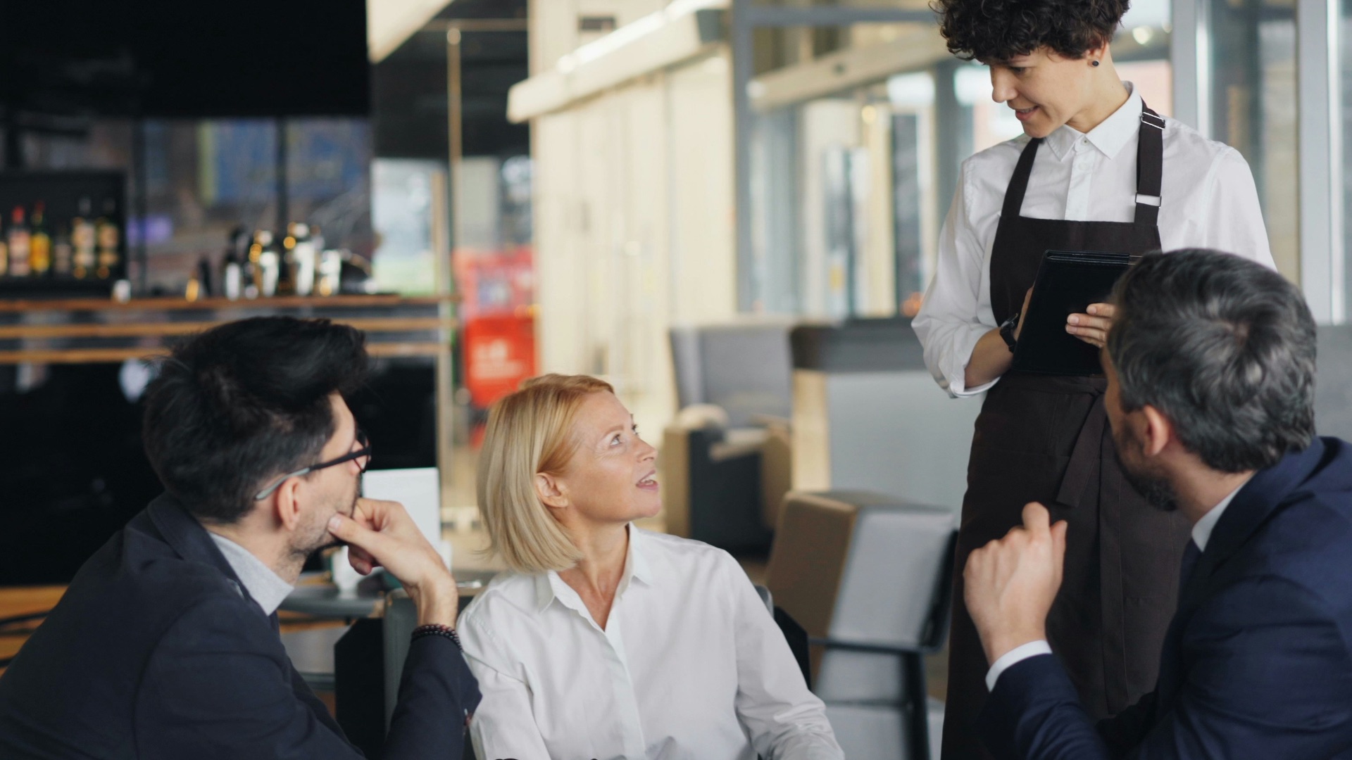 a group of people sitting around a table