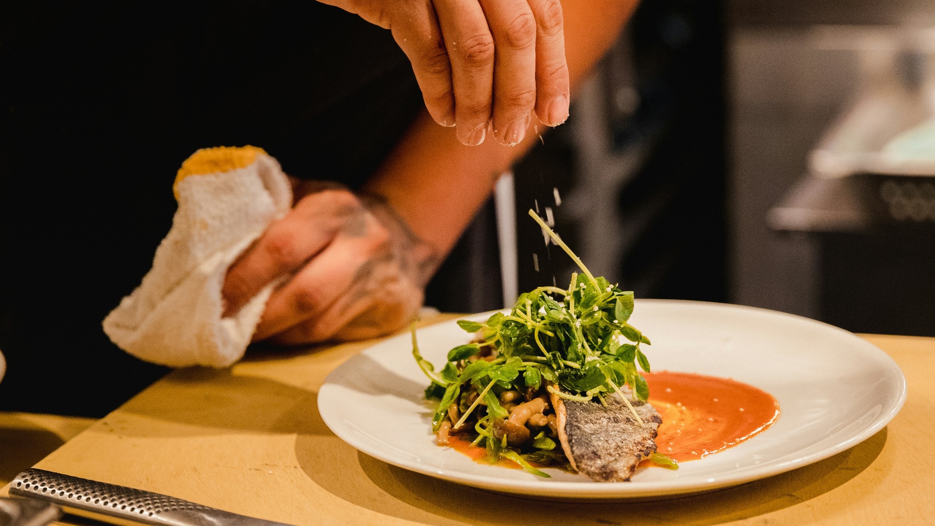 man standing front of plate with vegetable